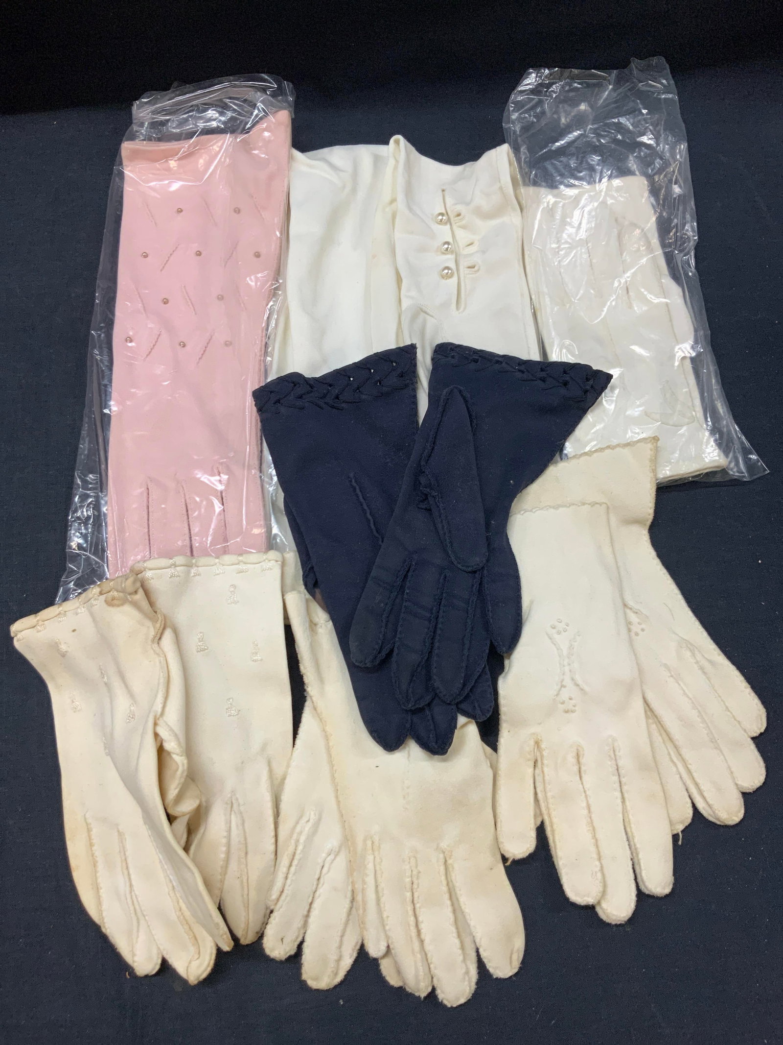 Lot 7 Pr Vtg Cotton & Suede Gloves: Lot of 7 pairs of gloves, suede and cotton. 1 pair of blue toned suede gloves. 1 pair marked double woven cotton by Lady Gay, and another pair marked cotton. Pair of elbow long gloves, marked 100% Nyl