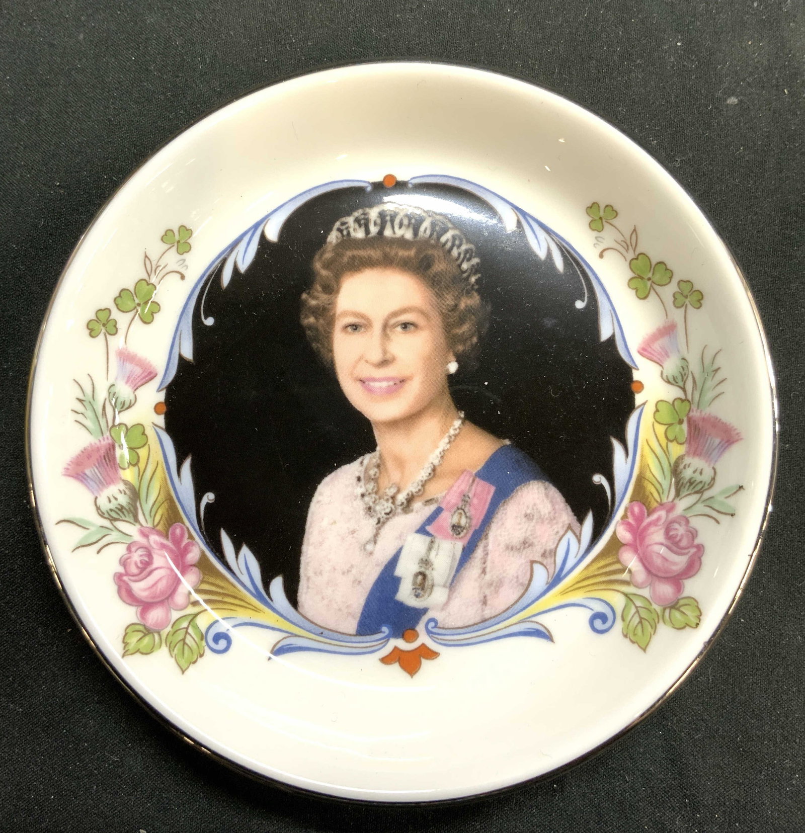 STAFFORDSHIRE Q Elizabeth Porc Trinket Dish W Box: Underside of dish and box each trademarked STAFFORDSHIRE ENGLAND. Dish has portrait of Elizabeth. Underside reads 70 Commemorate the silver jubilee of FM Queen Elizabeth Accession to the throne. 1952 