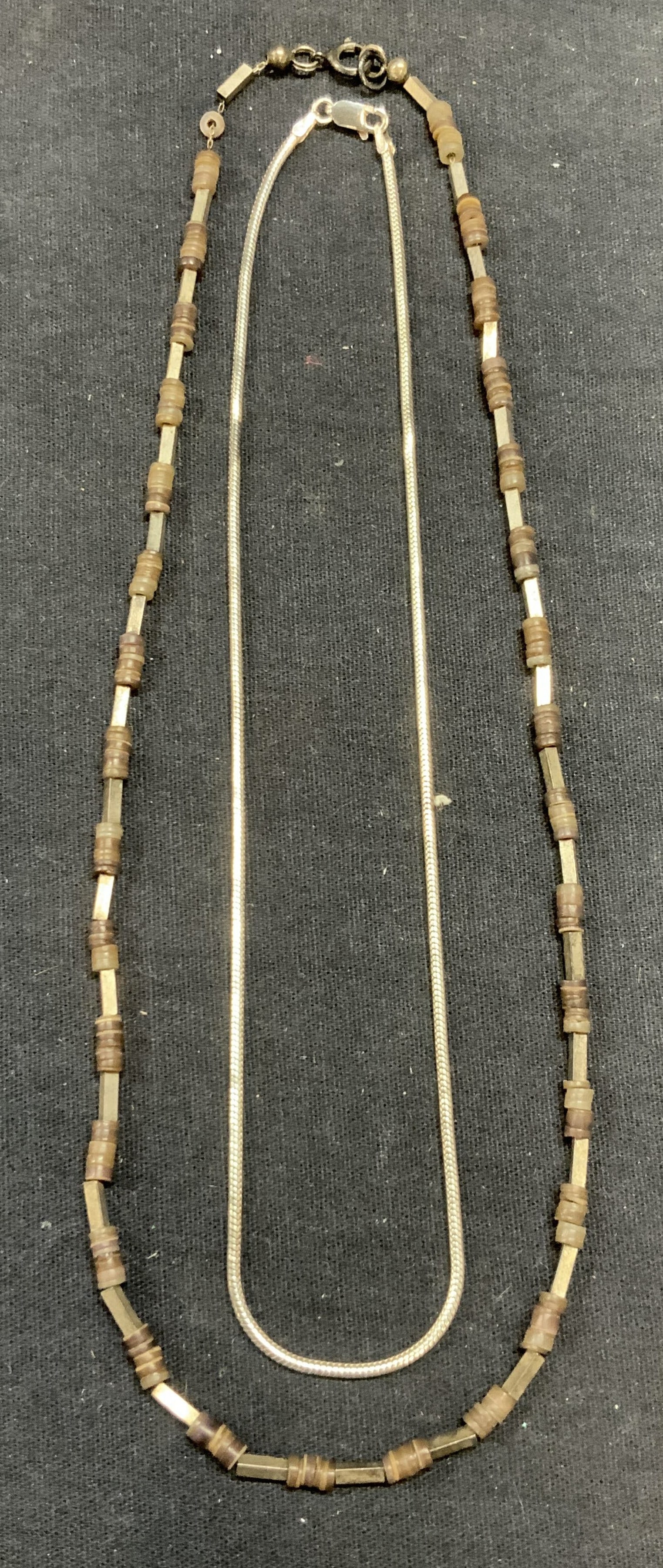 Lot 2 Sterling Silver Chain & Beaded Necklaces: Lot of 2 sterling silver necklaces. 1 snake chain and 1 beaded. Both marked sterling on clasps. Chain necklace made in Italy. Drop length of longest approx. 9 inches. Total weight of both pieces. 19.7