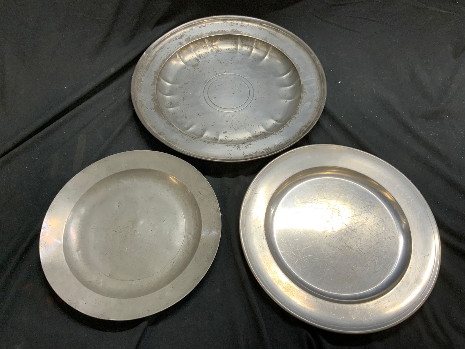 Antq & Vtg Lot 3 Pewter & Silver Tn Chargers: Lot Includes 1 antique pewter charger, 1 white metal possibly pewter charger inscribed HENRY FORD MUSEUM WOODBURY PEWTERERS & 1 white metal charger with MP Monogrammed and trademark (trademark illegib