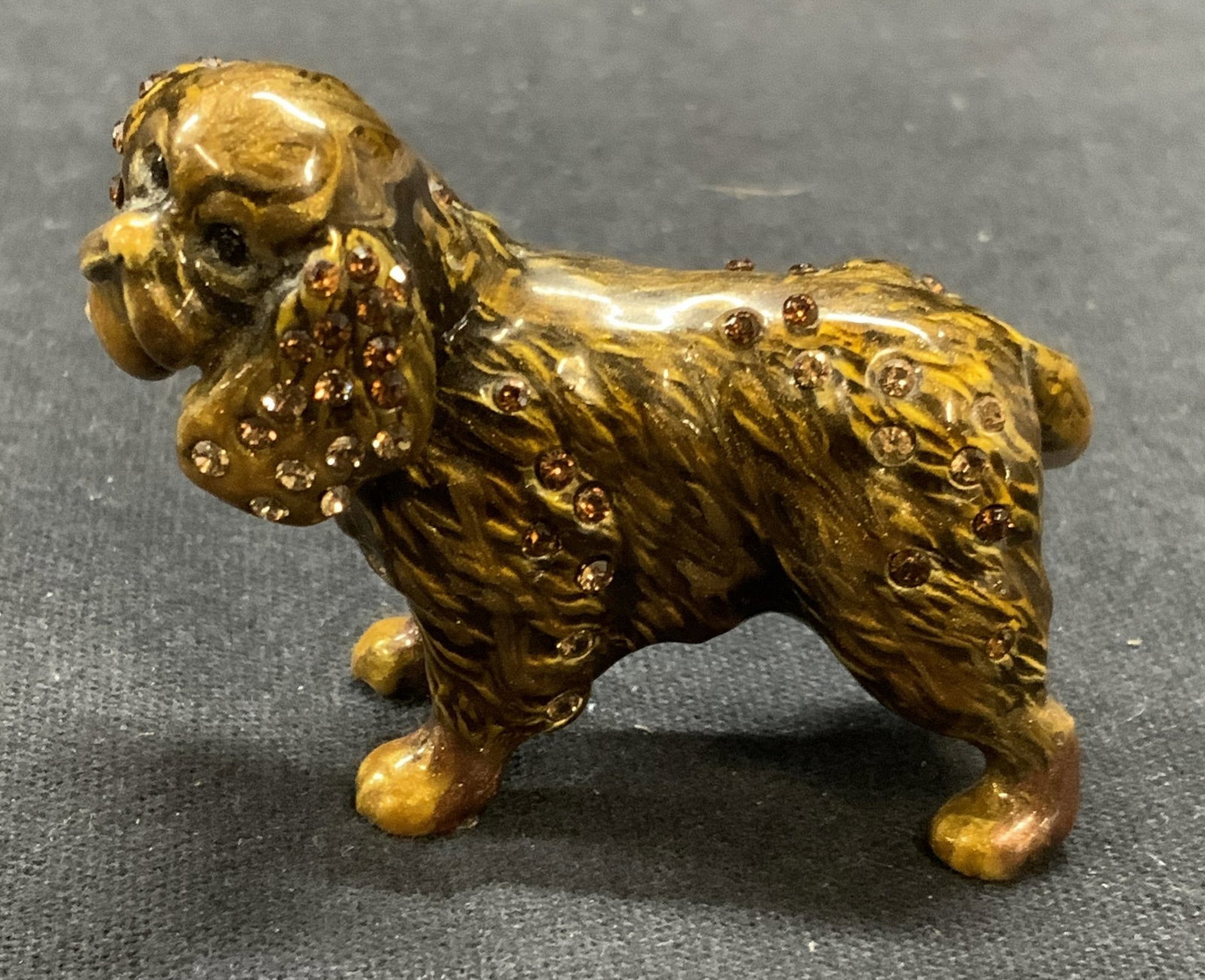 Jay STRONGWATER Enameled Crystal Dog Figurine: Jay STRONGWATER enameled metal and crystal decorated dog figurine. Trademarked to underside. Measures approx. 1.75 x .75 x 1.5 inches. Piece has weight. Loss to one crystal observed. Jay STRONGWATER, 