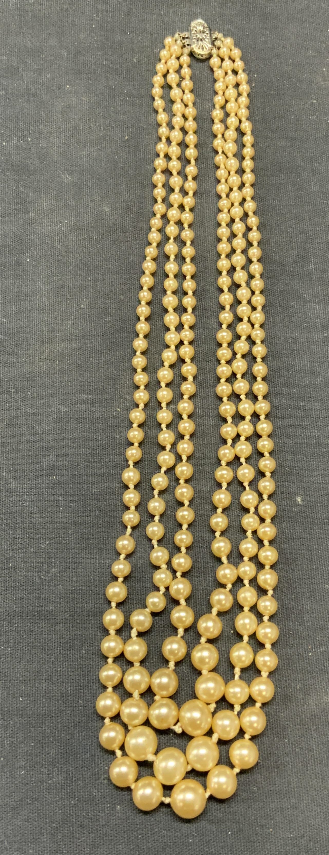 Vintage Faux Pearl Multi Strand Necklace: Vintage faux pearl beaded multi strand necklace. Drop length approx. 7.5 inches. Some surface wear including scratching observed. Estate jewelry, costume jewelry, cocktail jewelry, fashion jewelry, ac