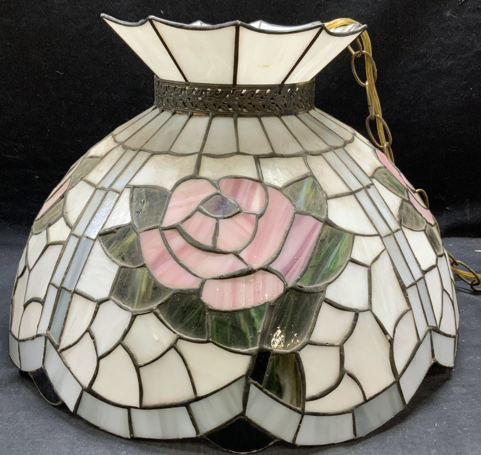Vintage Stained Glass Pendant Hanging Lamp: Vintage stained glass pendant chandelier lamp with floral motif. Hues of white, pink, and green. Measures approx 16.5 x 11 inches. Some surface wear including scratching observed. Not tested for funct