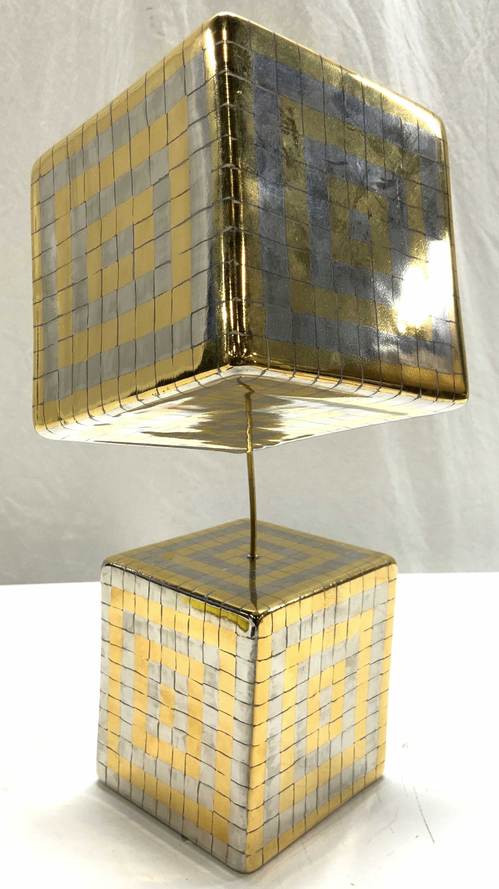 Signed Porcelain Cubic Sculpture: Sculpture is signed illegibly on underside. Piece has gilt and silver toned detail. Sculpture has 2 attached cubed Measures approximately 14.5 inches tall 6 inches wide 9.75 inches deep. Sculpture, cu