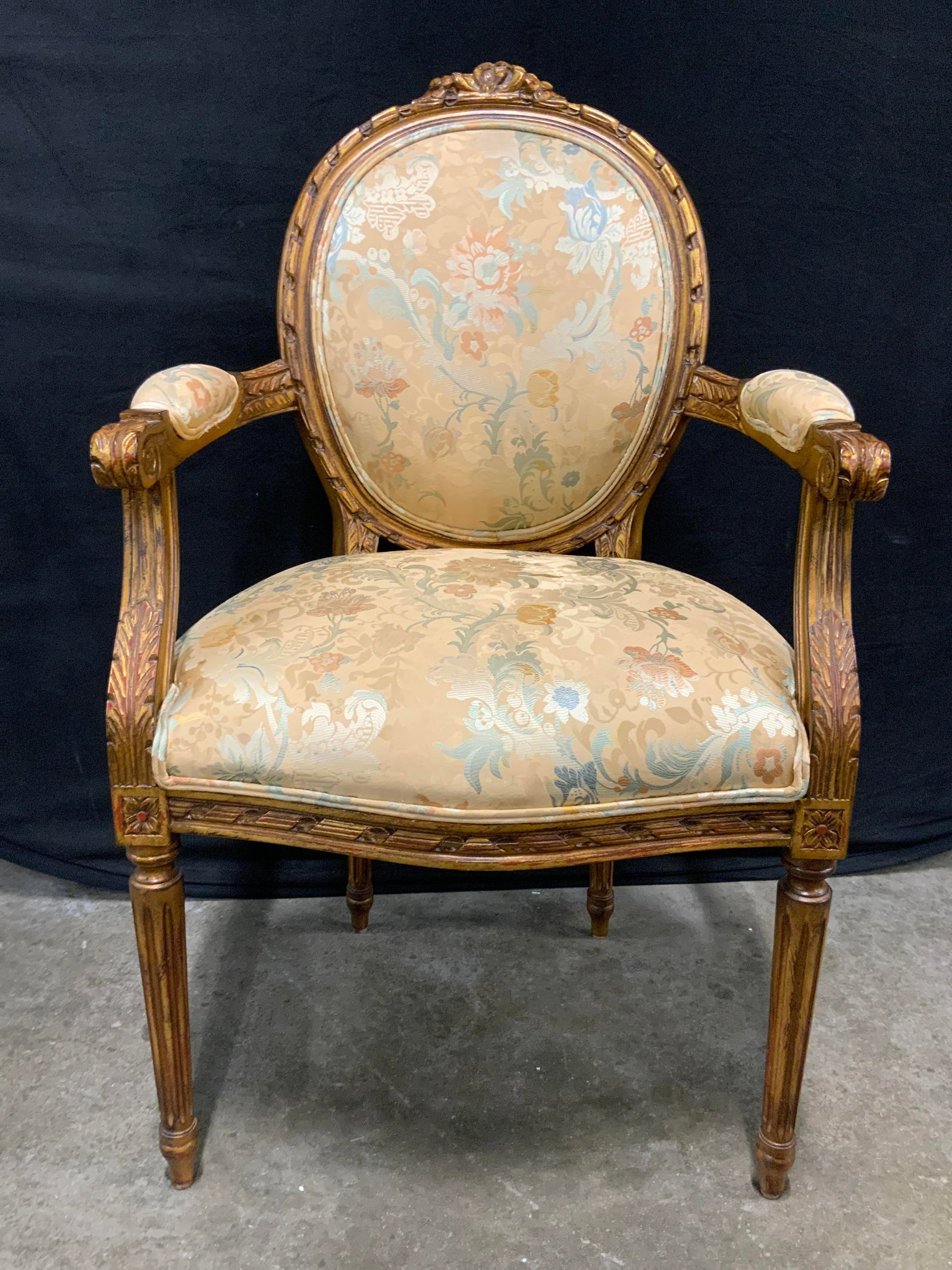 European Galleries Vtg French Armchair W Cust Uph: Tag on underside reads EUROPEAN GALLERIES INC. Chair is vintage. Piece has Giltwood frame. Chair has custom multi toned floral and leaf upholstery. Piece has 4 carved wooden legs. Arms have cushioned 
