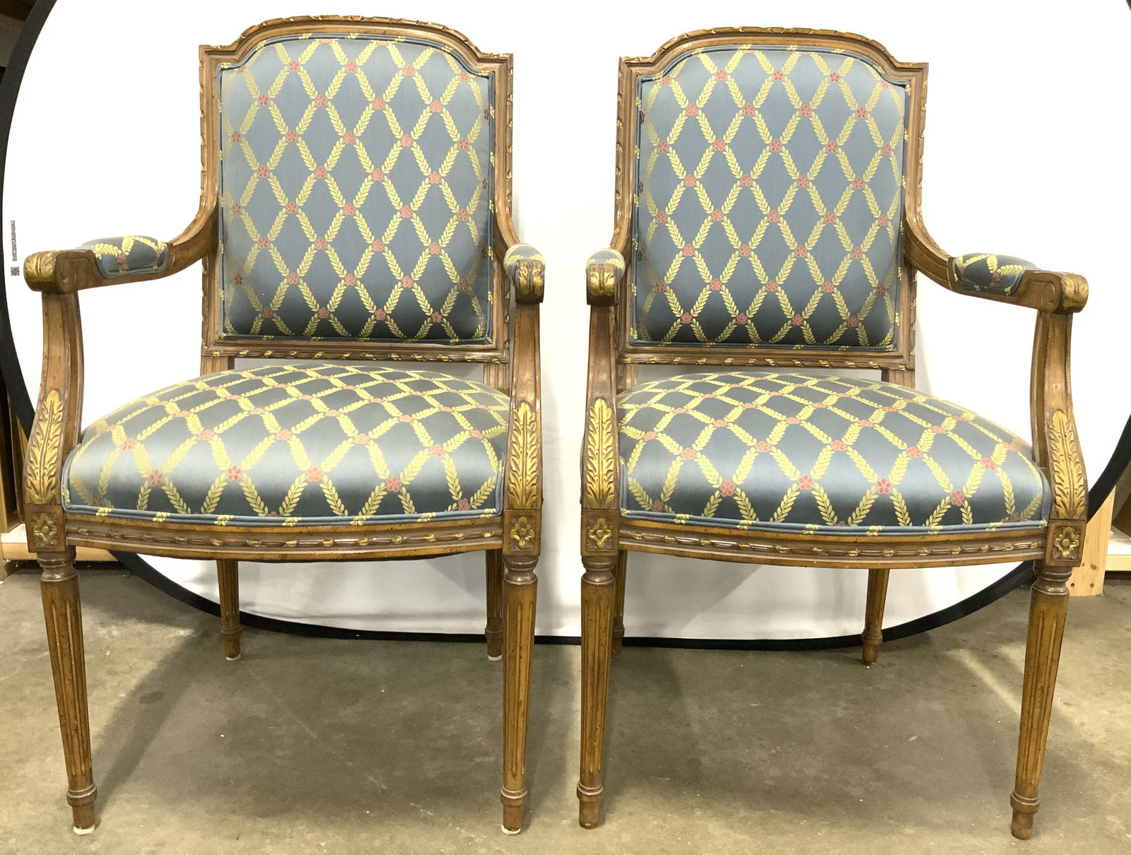 Pr Custom Uph French Style Armchairs: Lot includes 2 end chairs each are French Louis XVI style. Chairs each have custom floral vine and leaf detail. Chairs each have double welting at edges of upholstery. Arms have cushion upholstered ar
