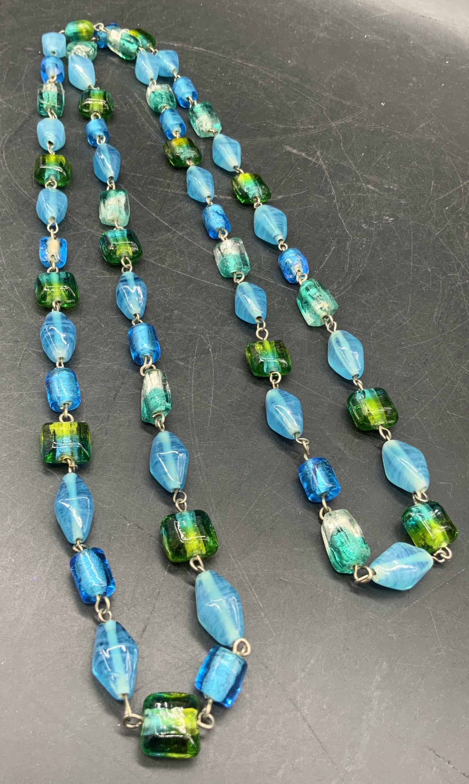 Blue & Green Glass Beaded Necklace, Jewelry: A blue and green glass beaded necklace. Lariat length. Drop length measures approx 20 inches. Some surface wear consistent with age, use, and exposure. Vintage jewelry, Vintage accessories, Fashion Je