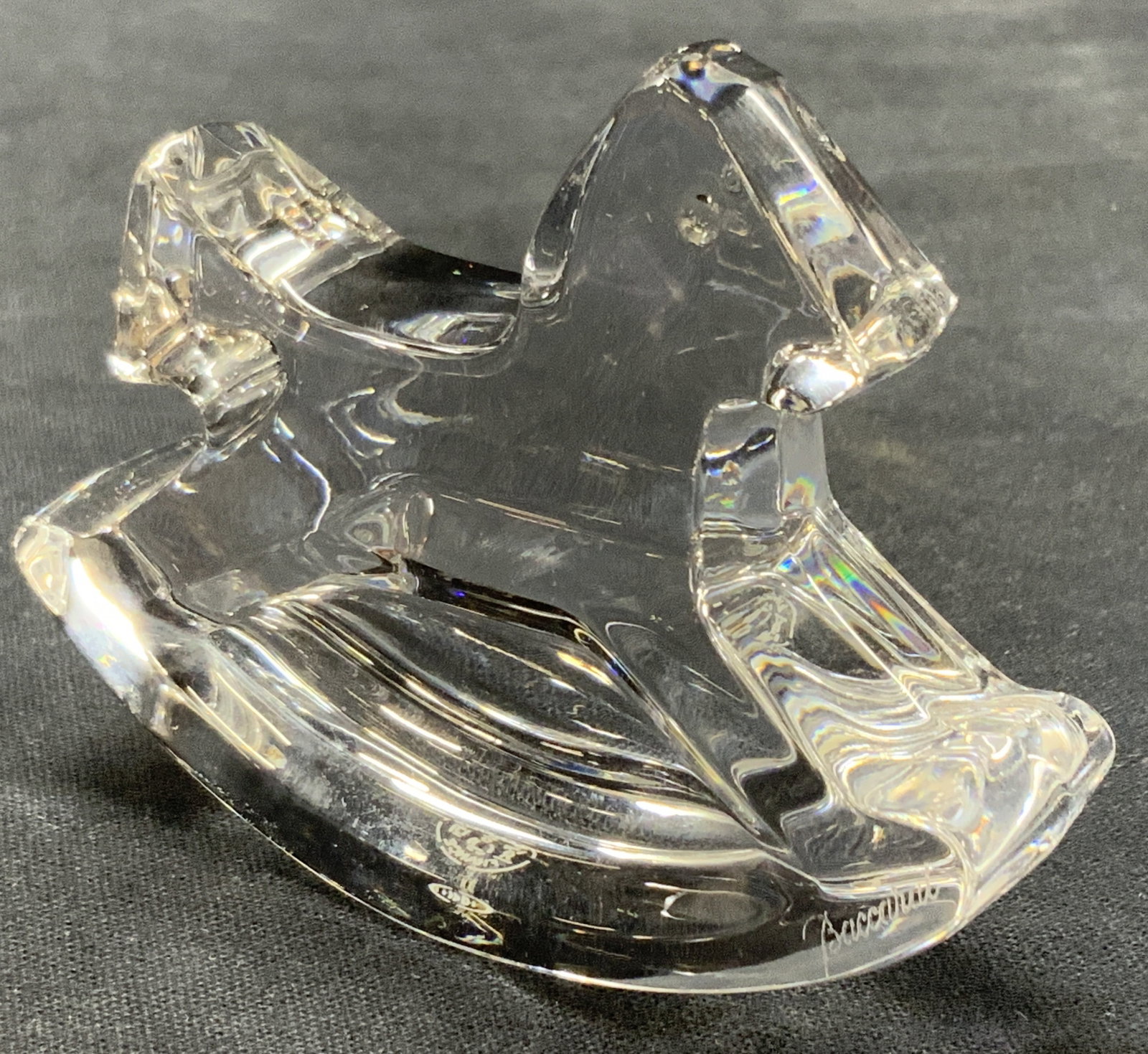 Baccarat Crystal Rocking Horse Figural, France: Crystal rocking horse figure stamped Baccarat on underside, France. Approx 2.5 inches tall and 3 inches long. Minor wearing to crystal due to age and exposure. Baccarat Crystal, crystal decor, home de