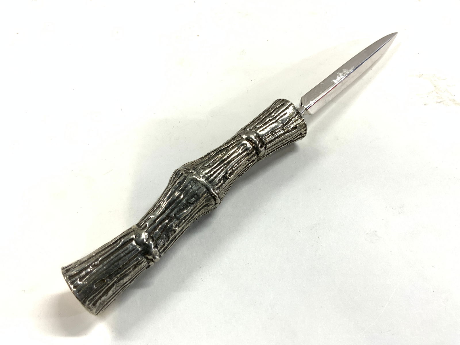 Vintage Pewter Handle Letter Opener Knife: Letter opener is vintage. Piece has silver toned pewter handle resembling branch. Blade possibly chrome. Piece measures approximately 8.25 inches long .75 inches wide. Letter opener, metal letter open