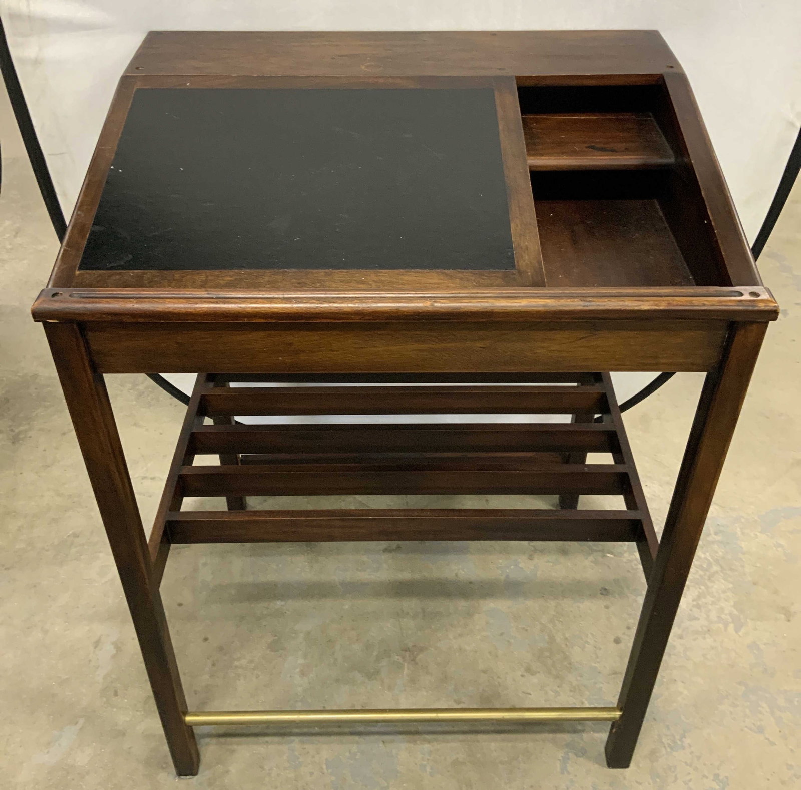 Vntg Wooden Podium W Leather Insert & Storage: Podium is vintage, brown toned & wooden. Piece has black toned leather insert on lid area. Piece has storage area underneath lid with leather insert. 50 inches tall 37 inches wide 29.5 inches deep. Po