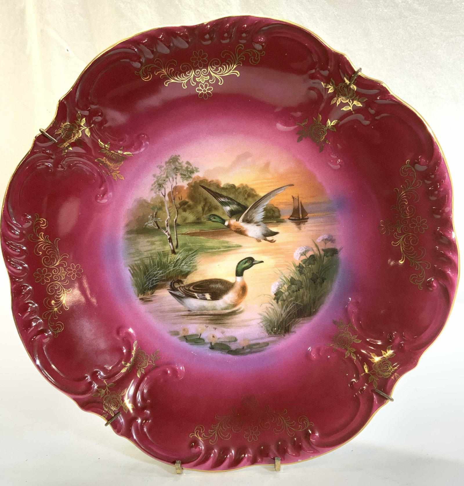CICO Bavaria Porcelain Mallard Duck Wall Plate,: CICO Bavarian Hand Painted Mallard Ducks and Landscape Porcelain Plate . Painted Cranberry with gilt accents, and center image of a river with a flying mallard duck and a swimming mallard duck. Cisco 