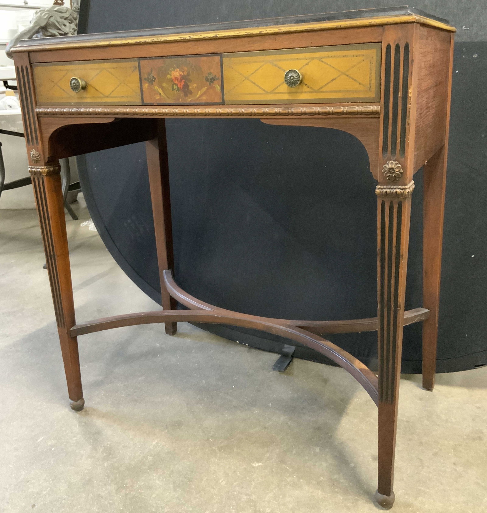 JOHNSON FURNITURE Vintage Wooden Desk W Drawer: Interior of drawer reads JOHNSON FURNITURE. Desk is vintage and wooden. Piece has 1 drawer with dovetailing and gilt metal knob style drawer pulls. Desktop has gold toned rectangular detail near edges