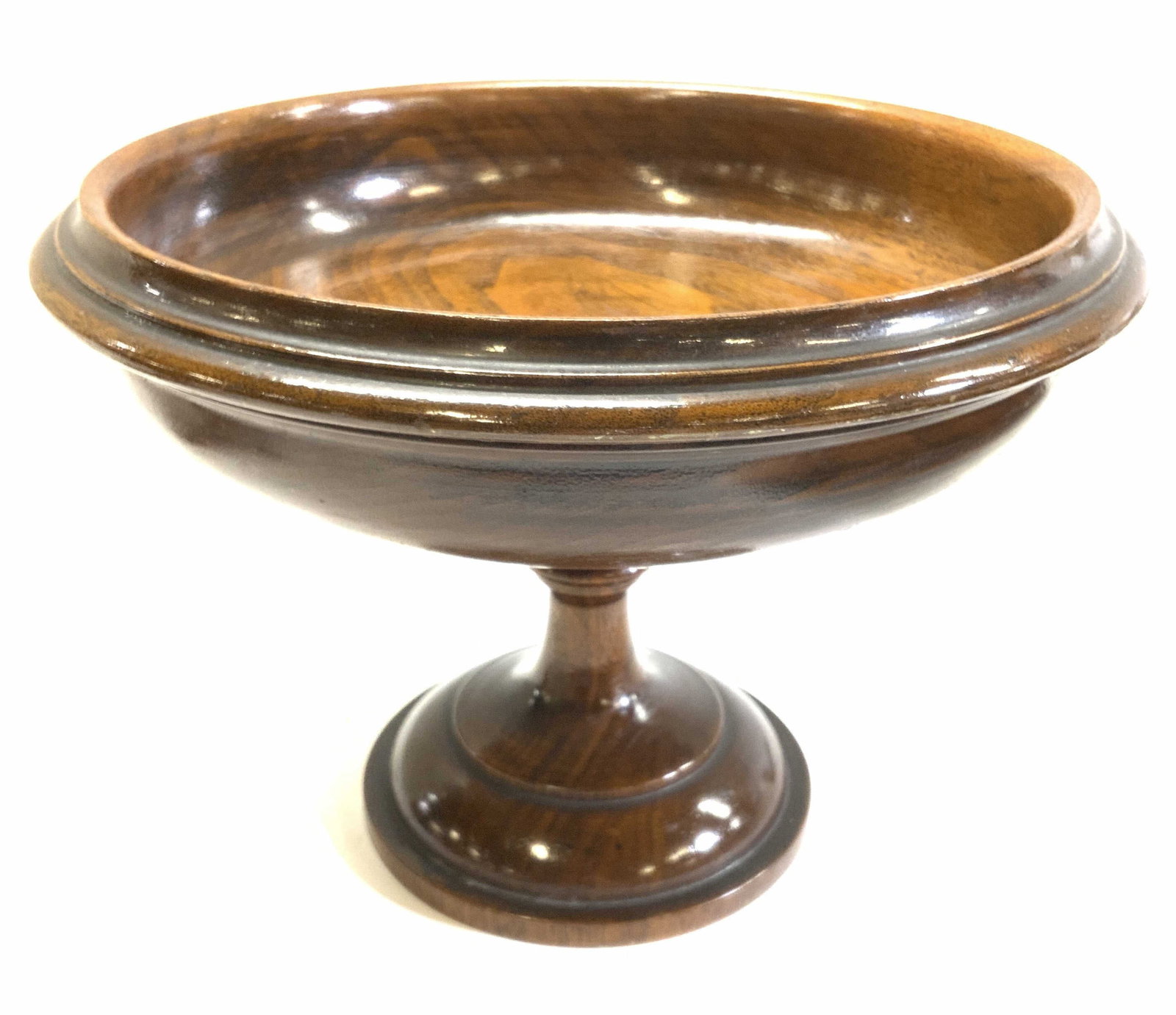 Carved Wood Footed Tazza Bowl Centerpiece: Hand crafted tazza bowl made of oakwood. 11.25 in. Wide x 8 in. Ht. Clear lacquer , some surface scratches. Handmade vintage tableware. Carved wood tazza bowl, carved oakwood centerpiece footed bowl, 