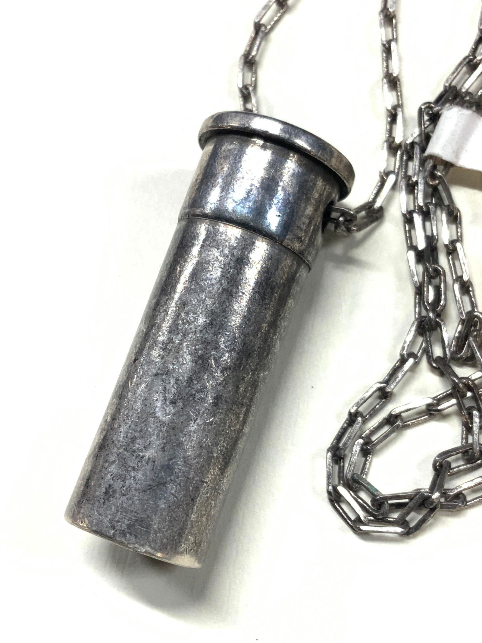 Aubaine NWT Faux Pewter Bullet Necklace: New with tag reading Aubaine. A faux bullet, possibly made of pewter with 12 FL MII etched oh it. Approx 13 inches long china and bullet being 2 inches long. Minor wearing to bullet and chain due to a