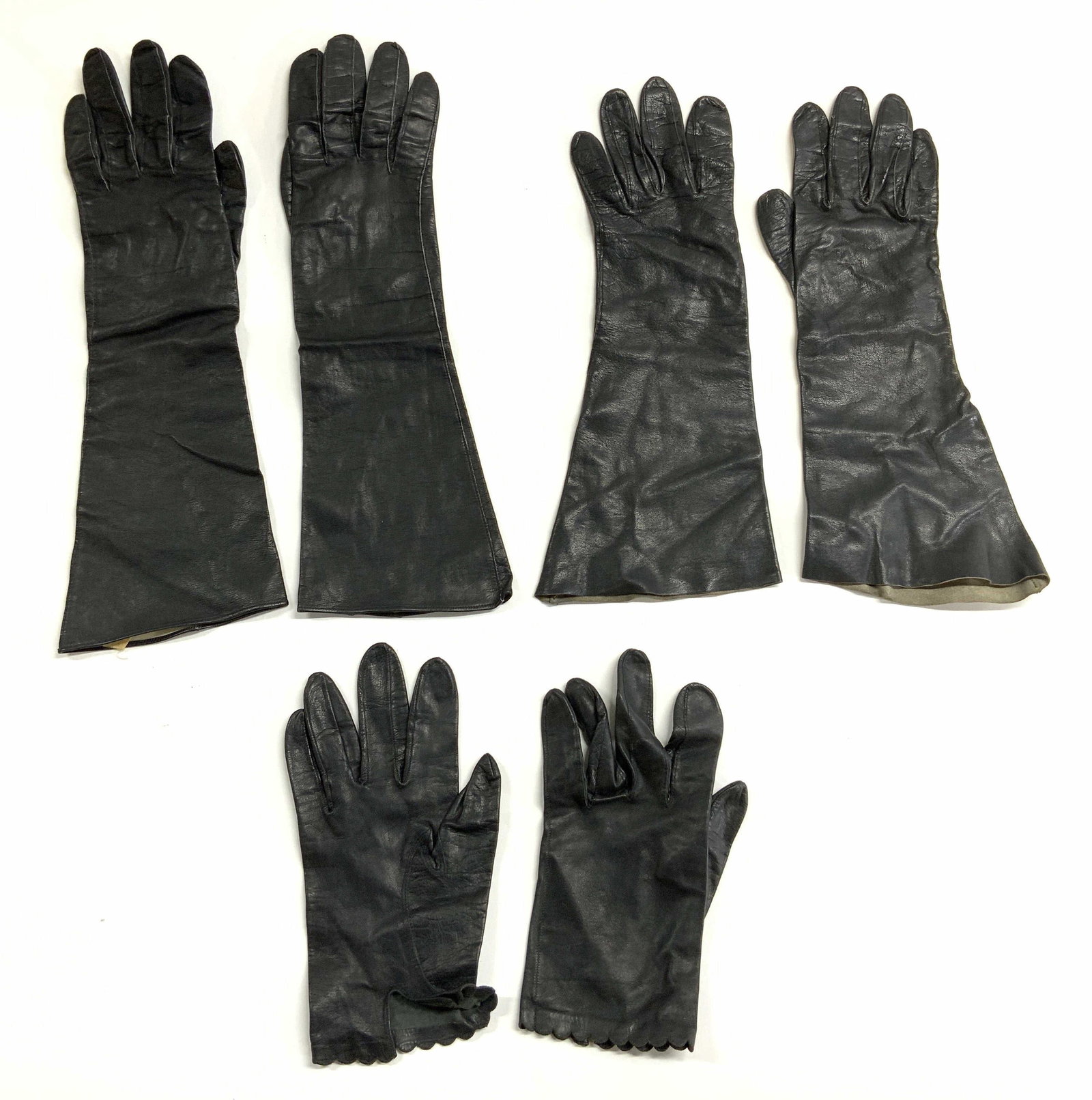 3 Pairs Black Leather Gloves ALEXANDERS France+: One pair marked MADE IN FRANCE. FOR ALEXANDERS. Lot includes 3 pairs of gloves. Each are black toned and leather. Each appear to be size 7 1/2. Longest pair measures approximately 14.5 inches long 5 i