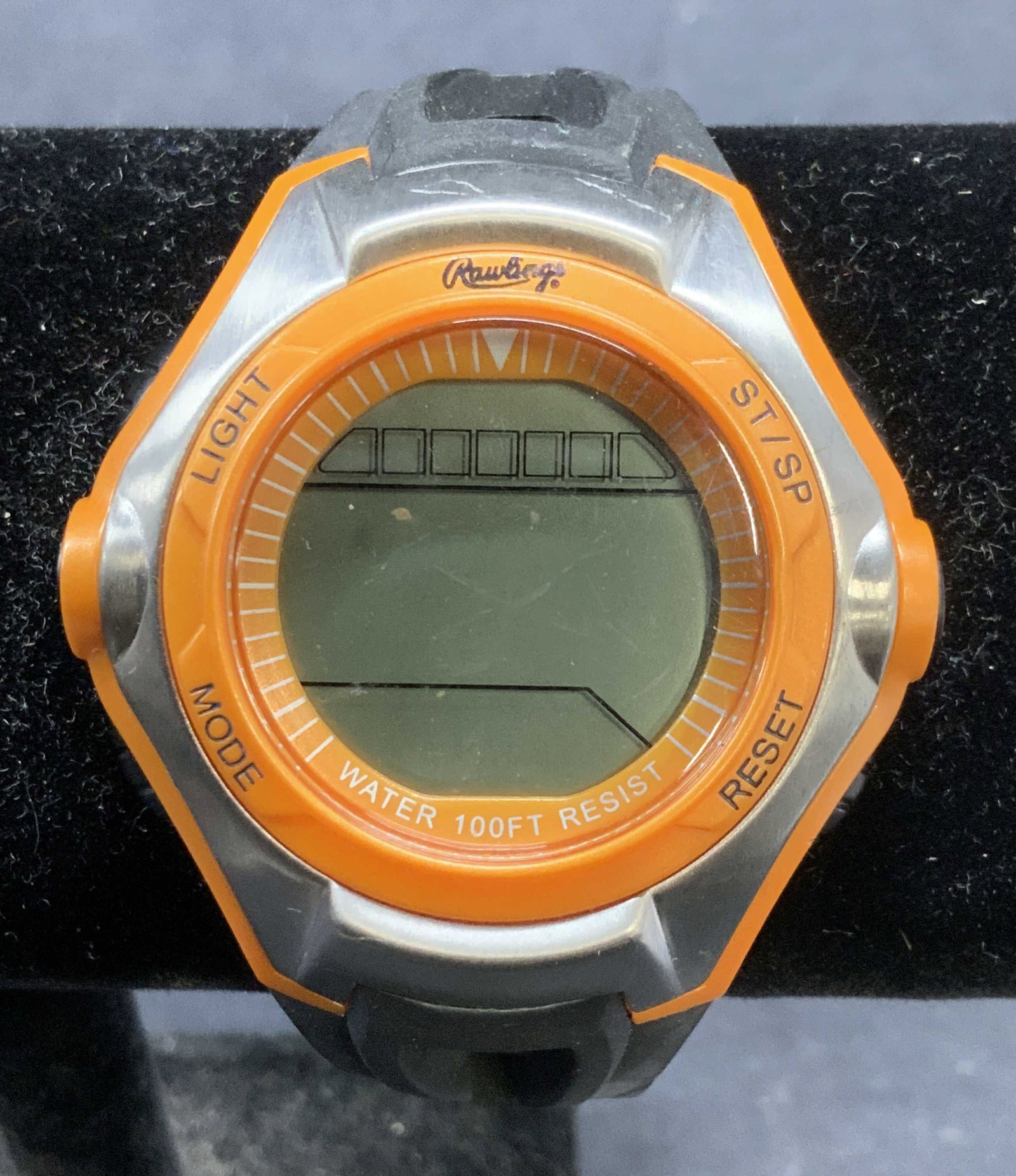 Rawlings Orange & Black Watch: Rawlings orange and black toned watch. Silicone band with metal and plastic face. Signed on face. Measures approx. 9 inches long. Not tested for function. Some surface wear including scratching observ