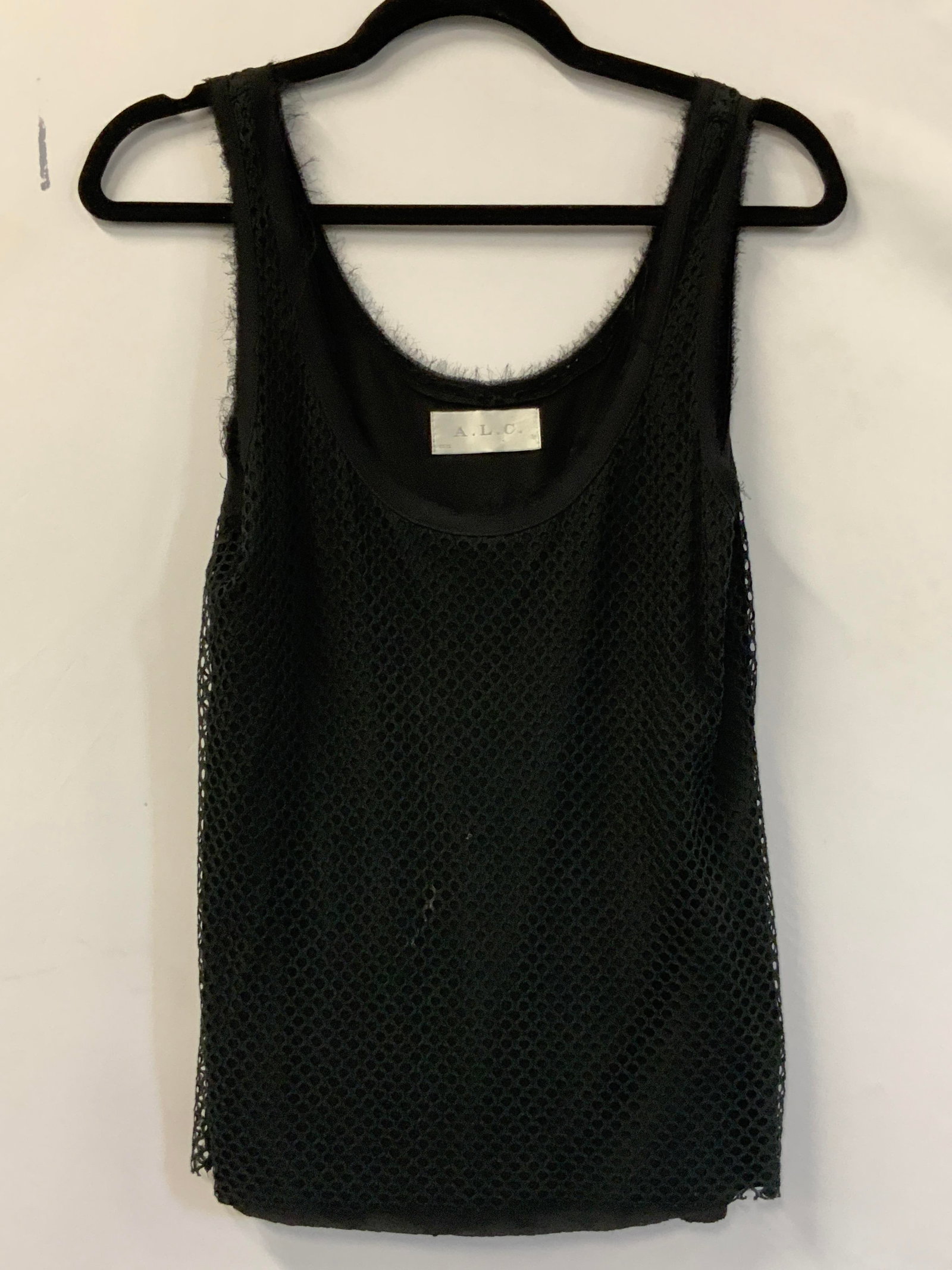 A.L.C. USA Black Frayed Mesh Tank Top: Black tank top with a frayed mesh overlay. Brand tag reads A.L.C. Size tag reads XS, MADE IN USA. Material tag reads Cotton, Polyamide, Viscose. Length measured flat from tank top strap to base 24.5 i