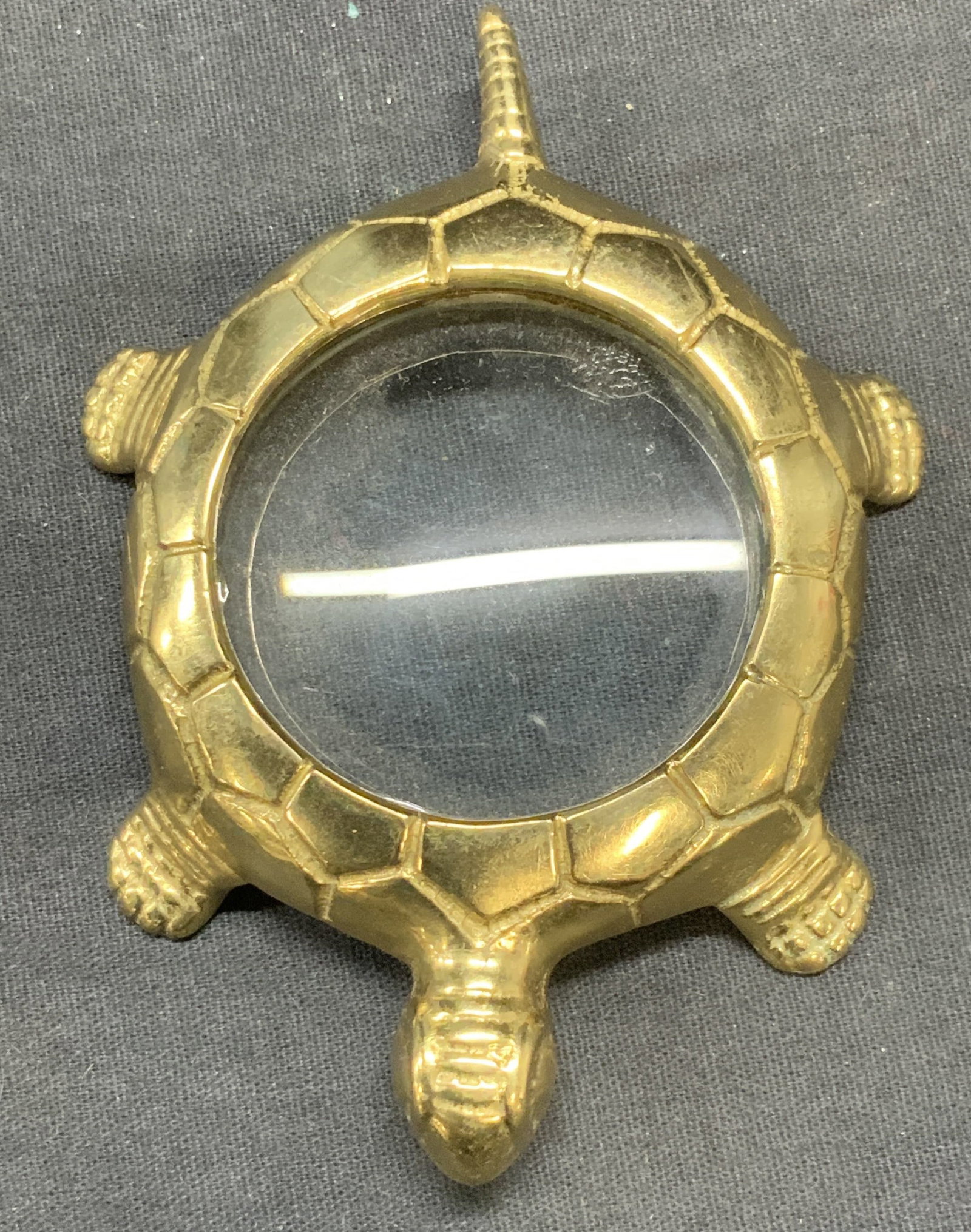 Gold Tone Turtle Magnifying Glass: Gold tone turtle motif magnifying glass. Measures approx. 4 x 3 inches. Some surface wear including scratching observed. Turtle, turtle Figural, turtle magnifying glass, magnifying glass, gold tone ma