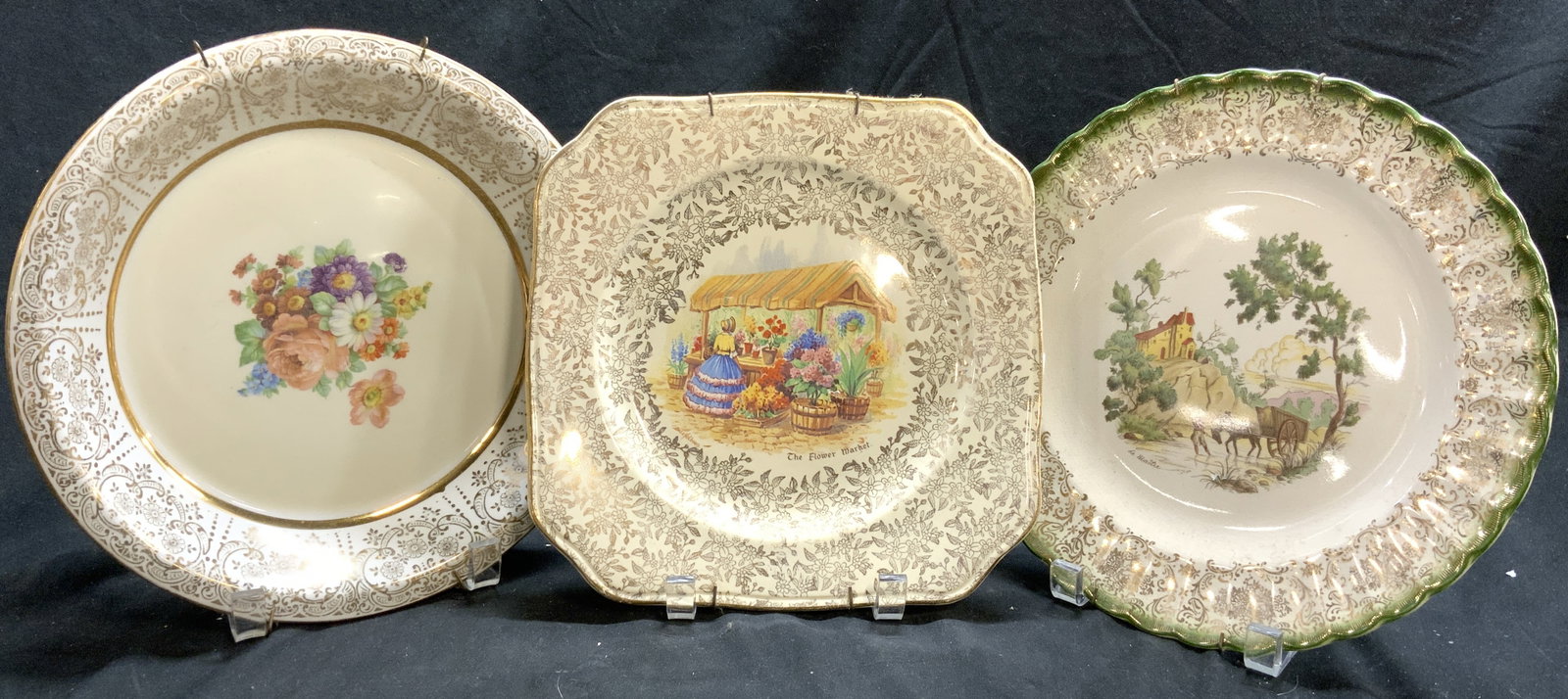 3 Vntg Gilt Porc Plates, Limoges France, Empire+: Trademarks include LIMOGES FRANCE, EMPIRE, & SYCAMORE. Lot includes 3 plates. One floral detailed center, one with image of Flower market with female figure & 1 with landscape image. Each have various