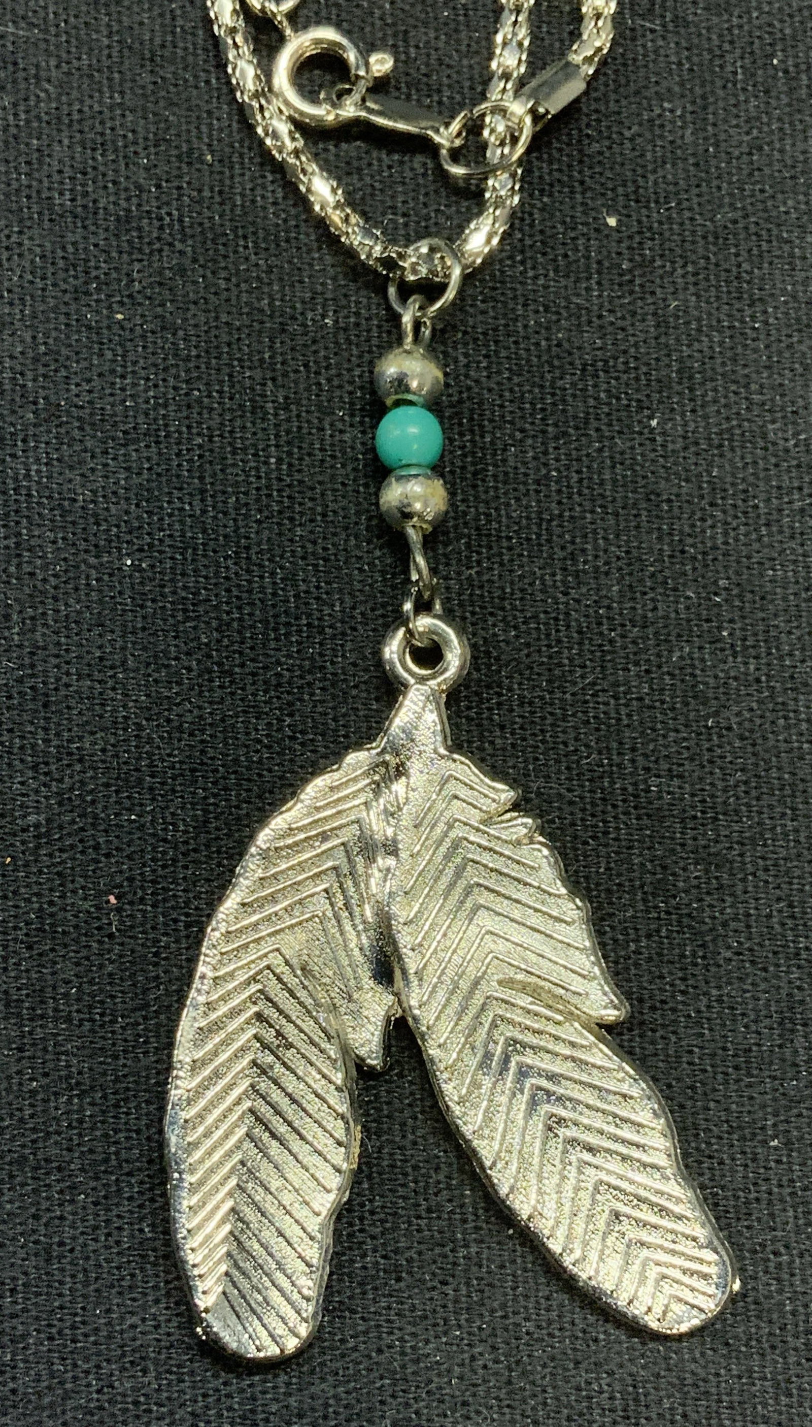 Silver Tone Leaf Pendant Necklace: Silver tone leaf motif pendant necklace with beaded decoration. Drop length approx. 9 inches. Pendant measures approx. 1.5 x 1.25 inches. Some surface wear including scratching observed. Estate jewelr