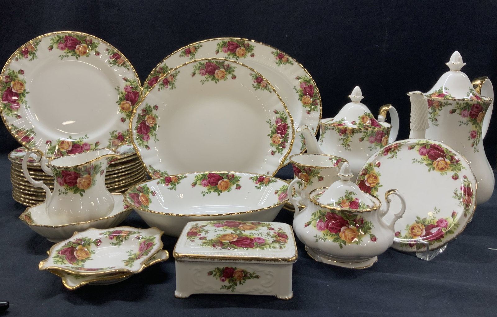 Set 115 Royal Albert Bone China, England: Set of 115 total Royal Albert fine bone China dishes. Comes with three original boxes marked Royal Albert, old country roses, adorn with gilt rims and red and gold rose motifs throughout. 2 boxes with