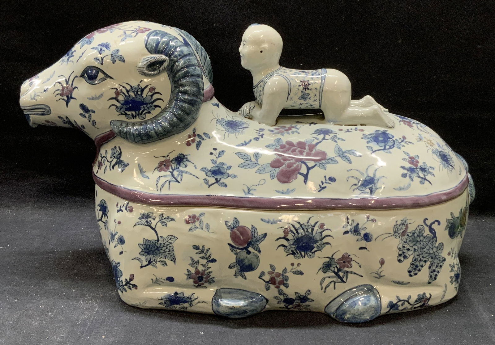 Vintage Chinese Porcelain Ram & Child Tureen: Vintage signed Chinese porcelain lidded tureen. Elephant form with child finial. Hand painted in blue and purple with floral motif. Signed to underside. Measures approx. 15.5 x 7.5 x 8.75 inches. Piec