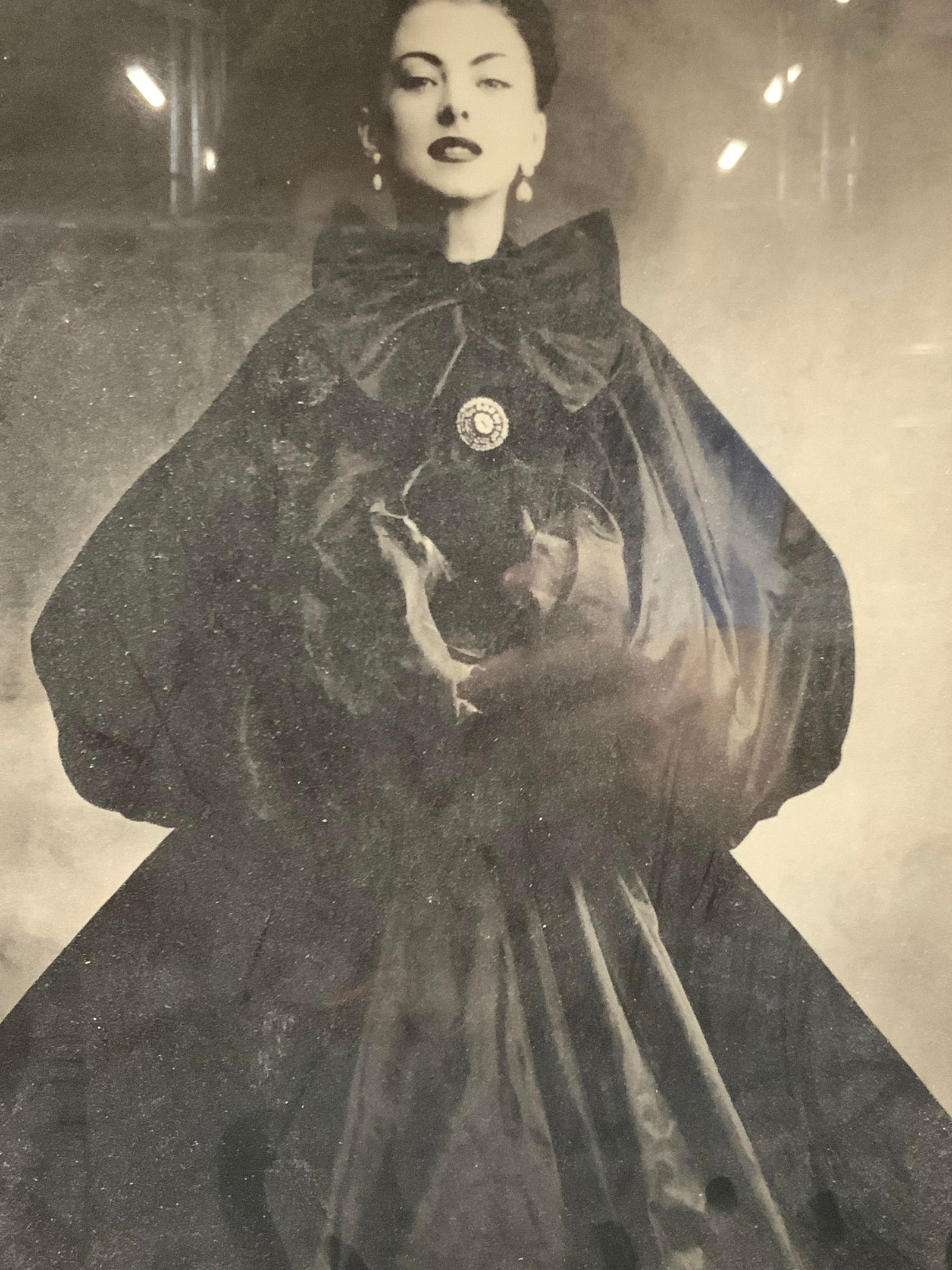 Framed Balenciaga Full Evening Dress Litho 1950: Framed lithograph of the vogue print of the Balenciaga full evening dress. Summer 1950 Depicts the model in the full black dress in black and white. Framed in a carved wooden and gold leafed frame, ca