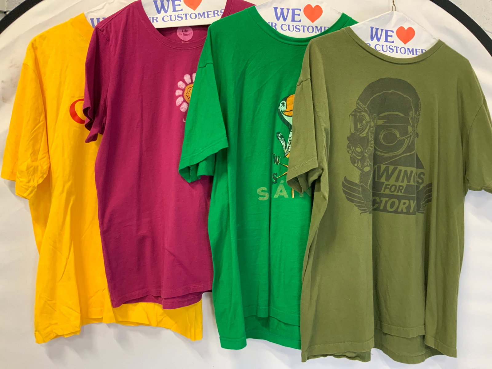 Lot 4 Graphic Cotton T Shirts, Call Of Duty & More: Lot of 4 graphic T shirts. All size XL. Olive green reading wings for victory marked Call of duty on tag. Magenta life is good shirt. 1 green shirt marked Slante with an image of a toucan in a weather