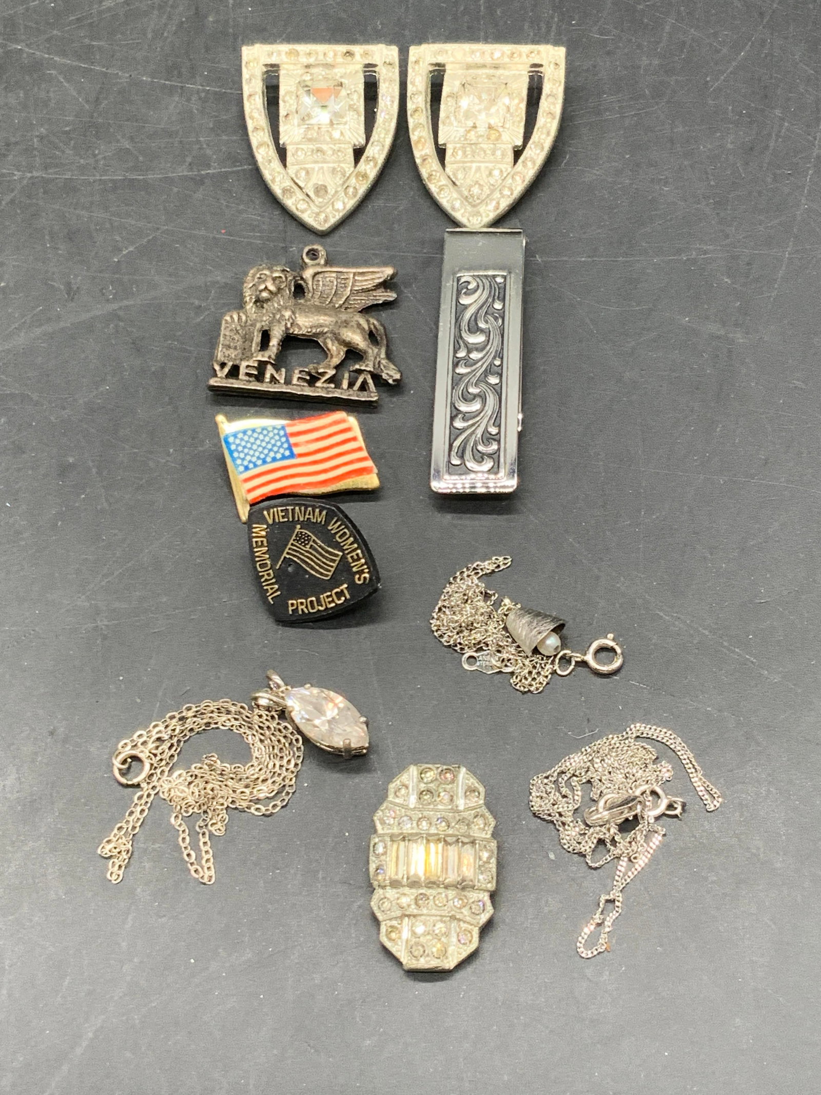 Grp Lot Sterling, 10K + Jewelry & Jewelry Pieces: A group lot of vintage jewelry and jewelry pieces. Lot includes pendants, shoe clips / sweater clips, necklaces, pins, and more. One partial necklace is marked NC 10K on the c spring and 925 on the cl