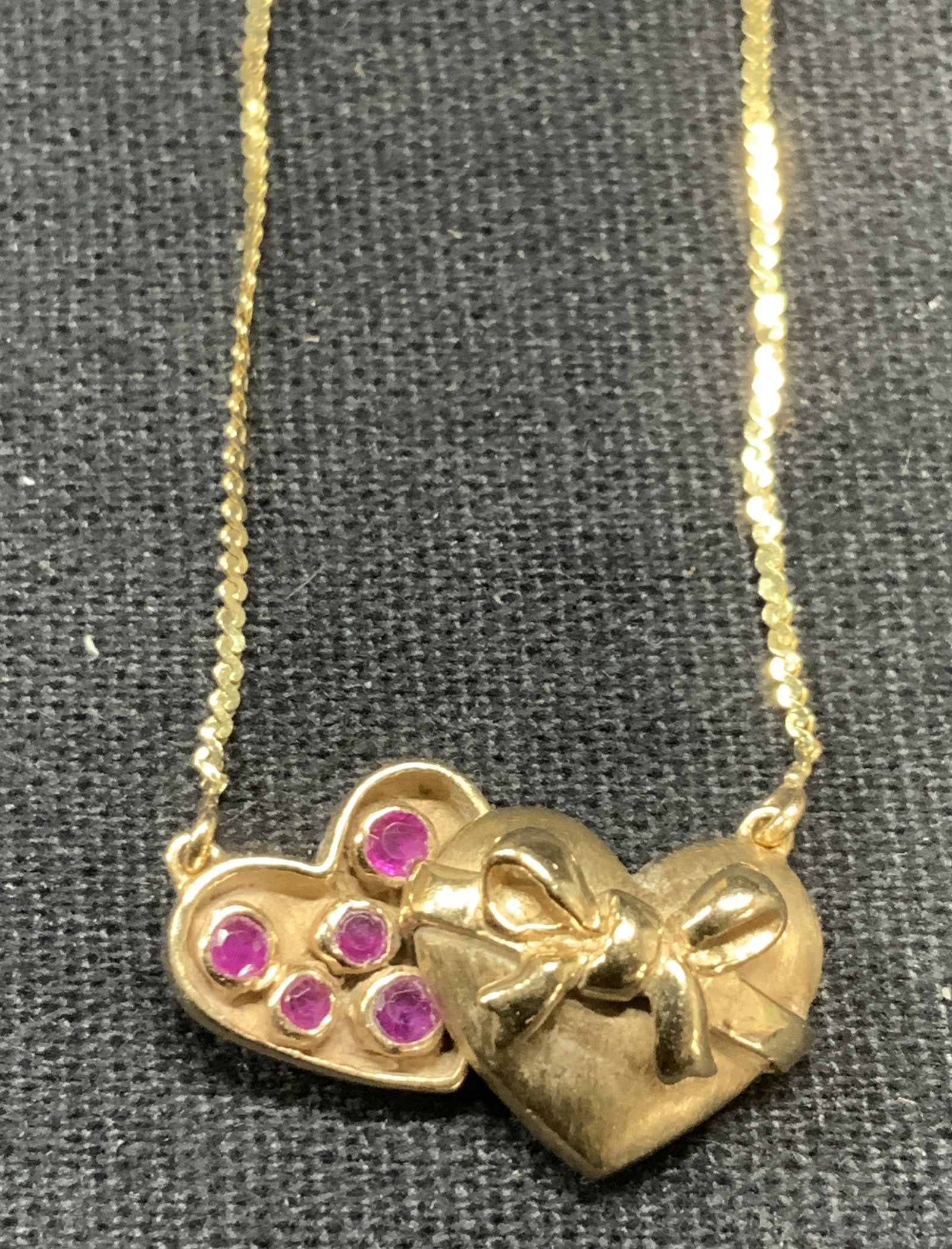 14k Gold Topaz Heart Pendant Necklace Italy: 14k gold pendant necklace with pink topaz and heart motif pendant. Marked 14k on clasp. Marked Italy on clasp. Drop length approx. 7.75 inches. Total weight 3.4 grams. Some surface wear including scra