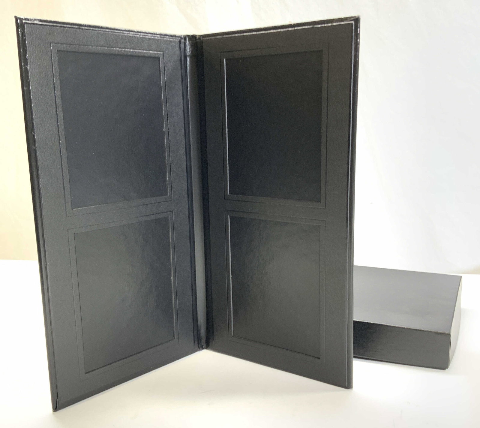 Prestige Faux Leather Portrait Holder, NIB: Prestige Portraits by Lifetouch black faux leather photo holder for 4.5 & x 3.5 in. photographs. Photo must be adhered to folder or placed into photo corners to be held on. New in box. 11 3/8 in.tall