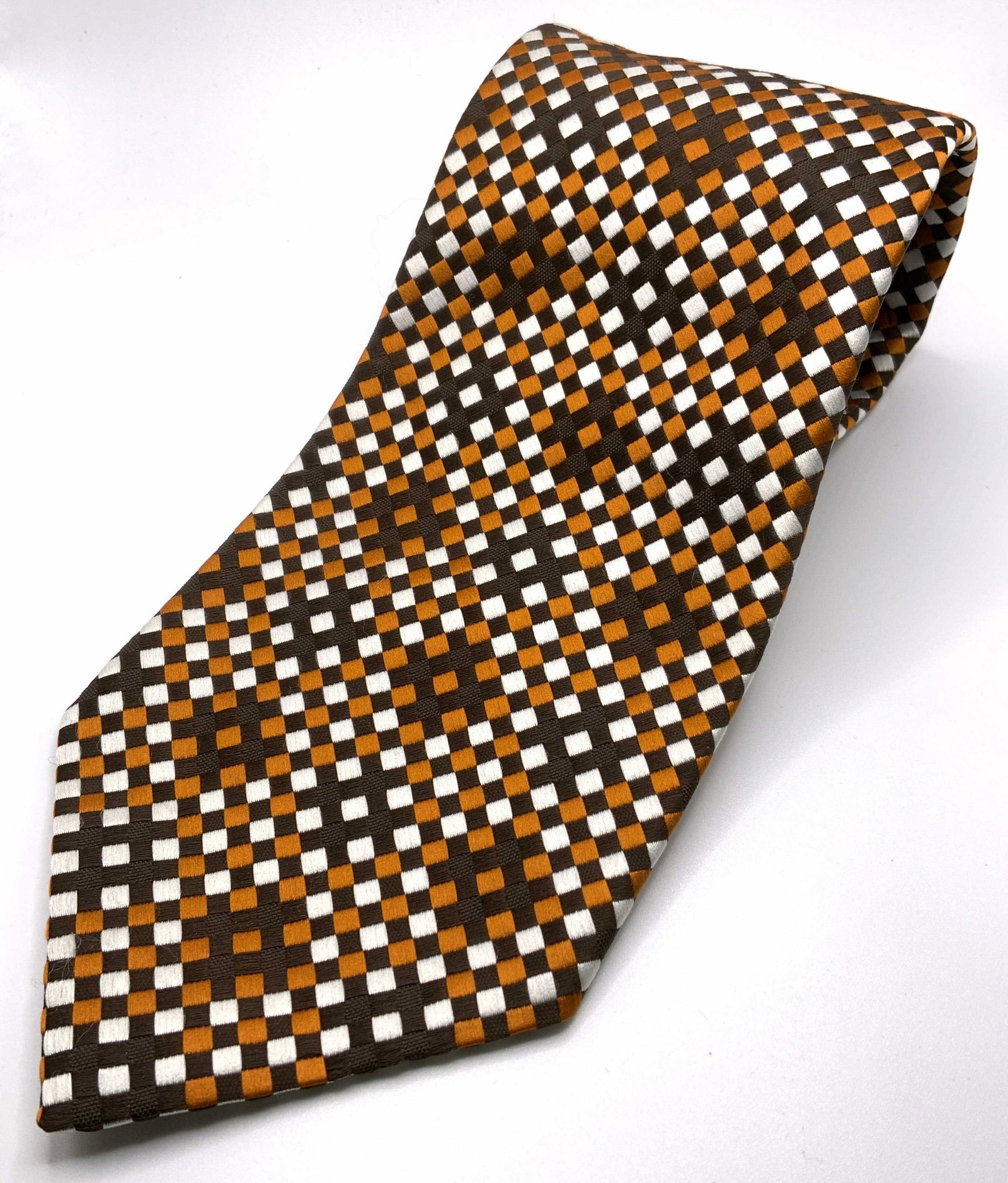 CHRISTIAN DIOR Vintage Necktie: Vintage necktie by Christian Dior. Label reads as All Polyester, Christian Dior, New York Paris Multi toned crosshatch pattern. Wear is consistent with use. Measures approx 53.5 inches long. Business