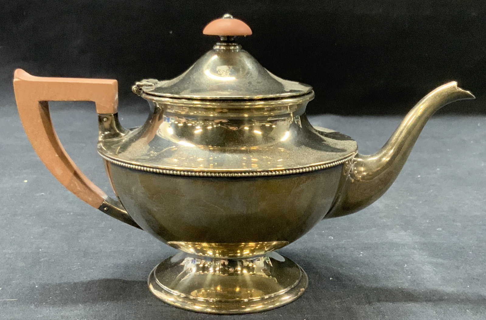Sterling Silver Stamped Kettle: Marked on underside Sterling, A10821 5/8 pint Made with brown toned finial and side handle. Approx 5 x 7 inches. Moderate surface wearing due to age and use Total weight of sterling is 7.10 ozt Sterli
