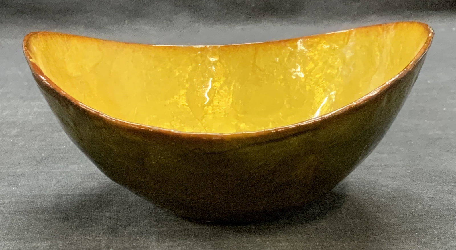 Yellow & Green Lacquered Serving Bowl: Yellow and green toned lacquered composite serving bowl. Measures approx. 5.25 x 2.5 inches. Some surface wear including scratching observed. Bowl, serving bowl, green bowl, yellow bowl, lacquered bow