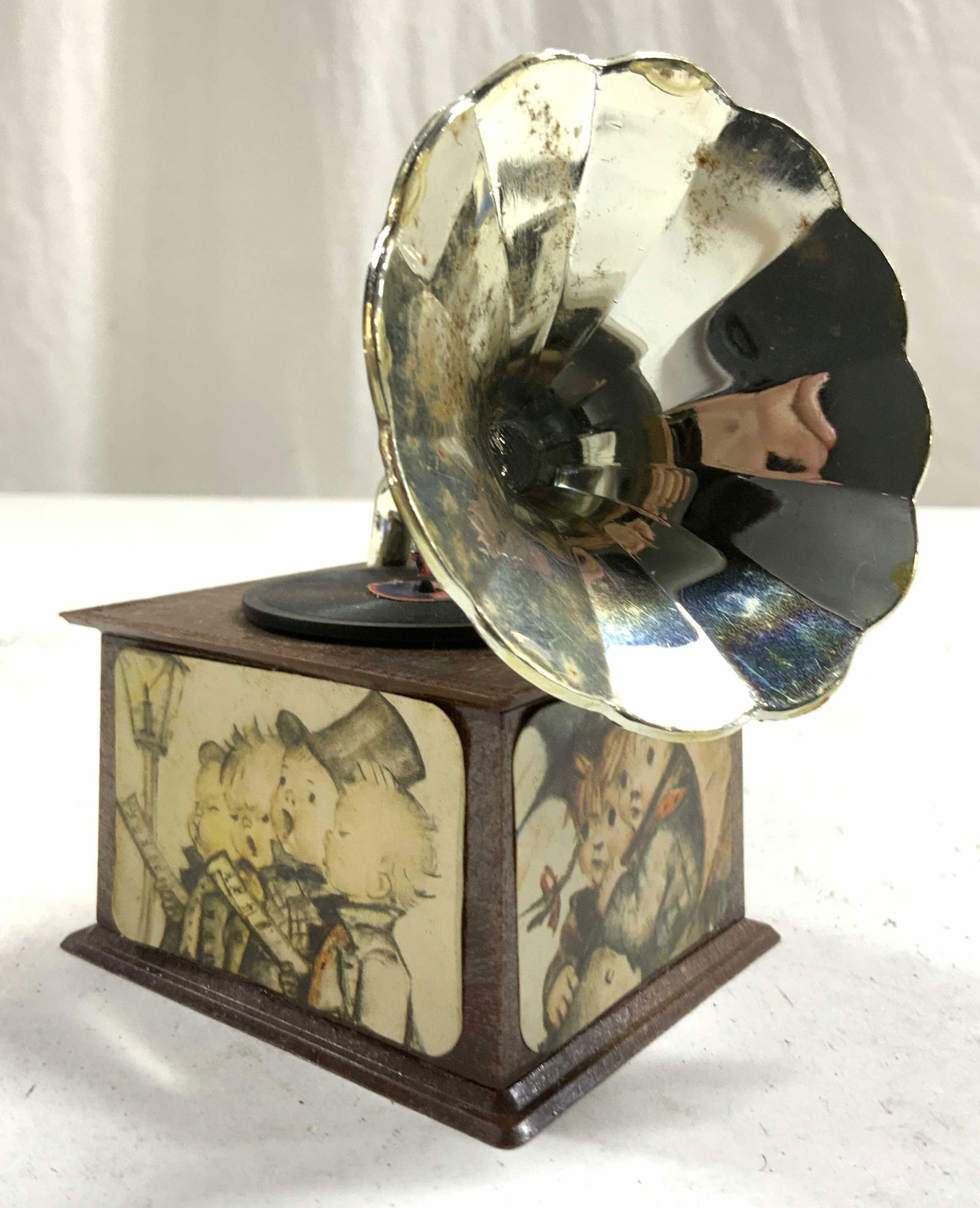 SANKYO Gramophone Music Box TALK TO THE ANIMALS: Wind on underside reads S. Music box has Gramophone form. Tag on underside reads TALK TO THE ANIMALS. Sides have depictions of various children. Piece measures appear 4.25 inches tall 3.5 inches deep