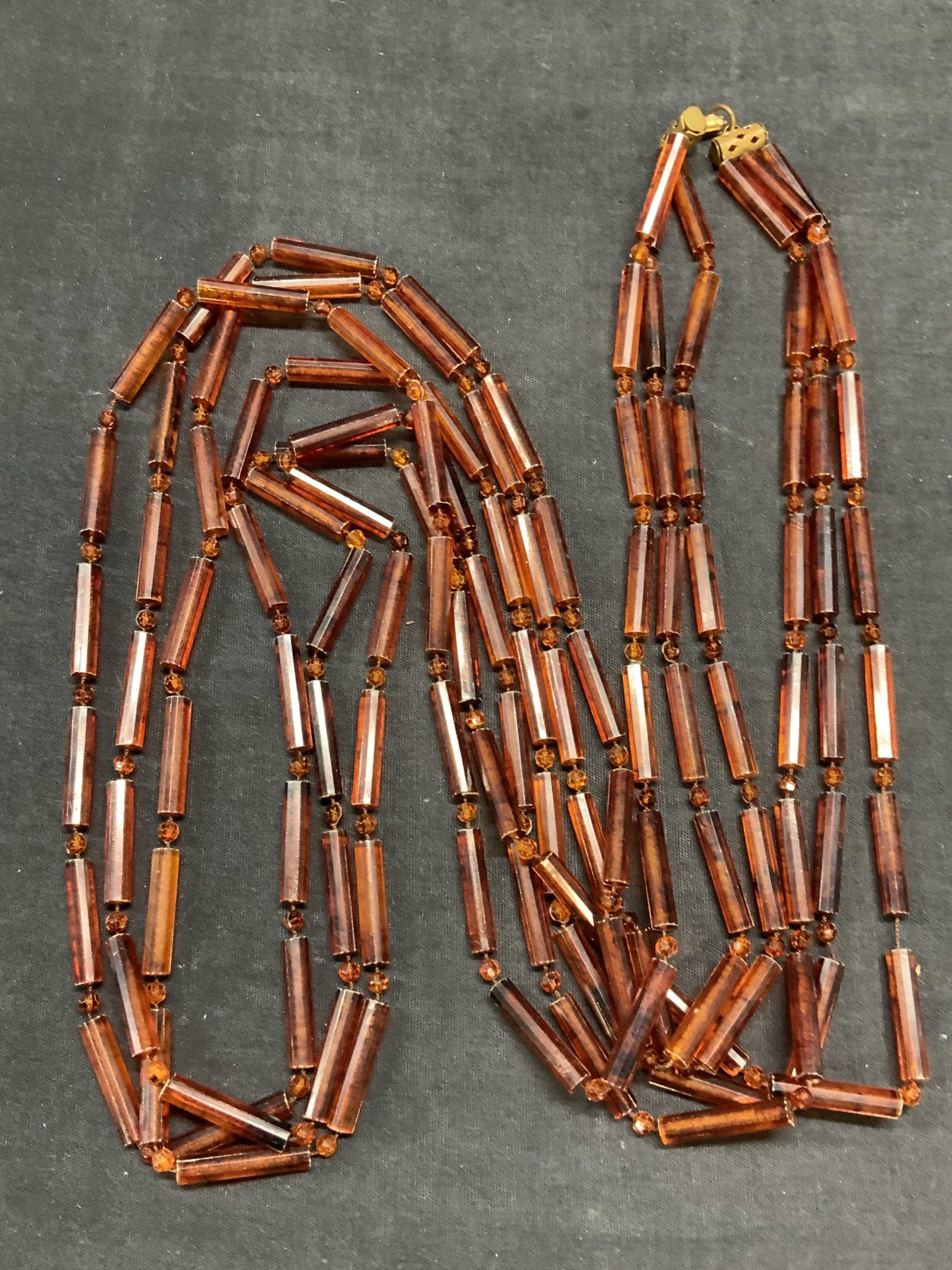 Vintage Amber Style Beaded Multi Strand Necklace: Vintage amber style beaded multi strand necklace. Drop length approx. 25 inches. Some surface wear including scratching observed. Estate jewelry, costume jewelry, cocktail jewelry, fashion jewelry, ac