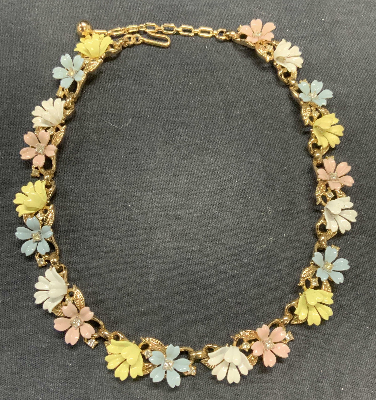 Vintage Gold Tn Enameled Flower Choker Necklace: Vintage gold tone enameled flower and crystal decorated choker necklace. Drop length approx. 7.5 inches. Some surface wear including scratching observed. Estate jewelry, costume jewelry, cocktail jewe
