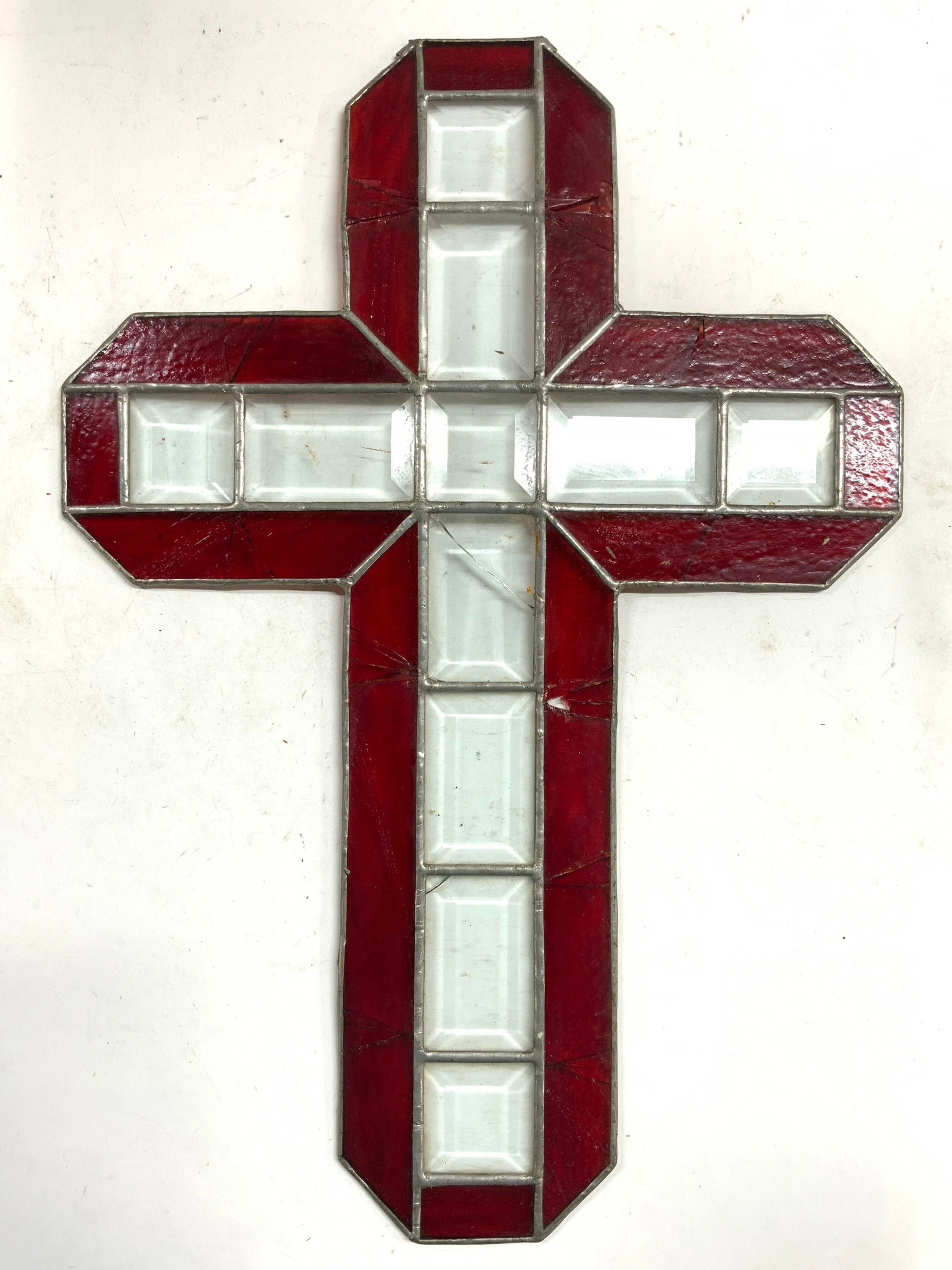 Vintage Stained Glass Art Glass Cross: Cross is vintage, piece is stained glass with red toned edges & clear interiors. Piece has metal in between panels. Cross measures approximately 20.5 inches tall 14.5 inches wide. Cross, glass cross, 