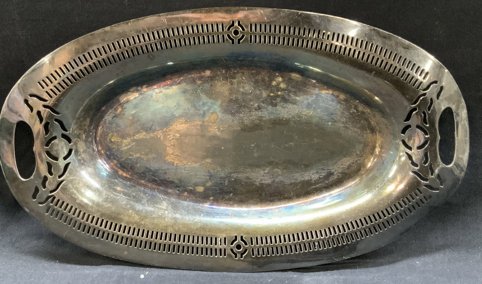 Vntg Rogers Silver Plate Tray 12in: Vintage silver plate Rogers tray with cut outs on outer edges and designs on side handles. Approx 12 x 7 inches Evident discoloration and wearing to tray due to age and use. Vintage decor, vintage tra