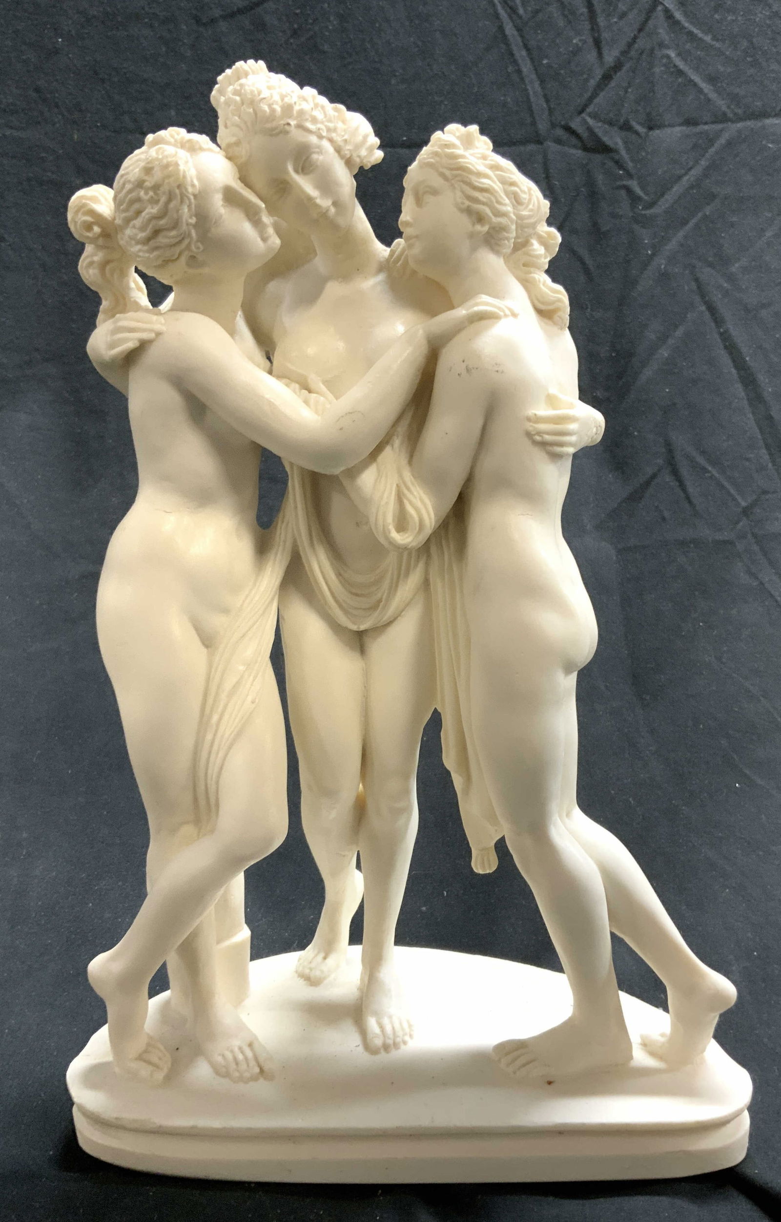 THE THREE GRACES Vntg Alabaster Female Nudes: Figure depicts THE THREE GRACES, Three female nude figures embracing. Piece is cream toned, appears to be alabaster possibly resin. Sculpture measures approx 11 inches tall 7 inches wide 3.5 inches de