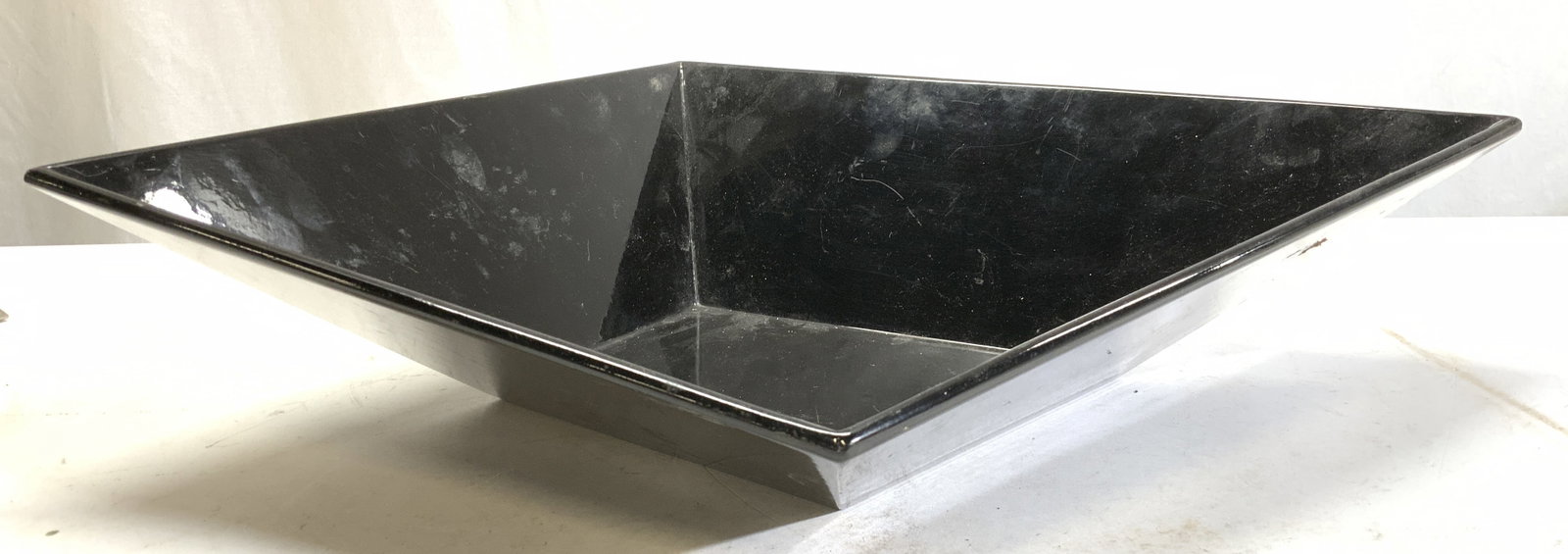 Geometric Shape MC Modern Centerpiece Bowl: Black angular geometric shape bowl. Perfect as a centerpiece. Measures 13 x 15 in. ( the longer lengths) and 4 in. ( the tallest ht) Surface scratches noticed. Vintage ware, Home wares, Abstract cente