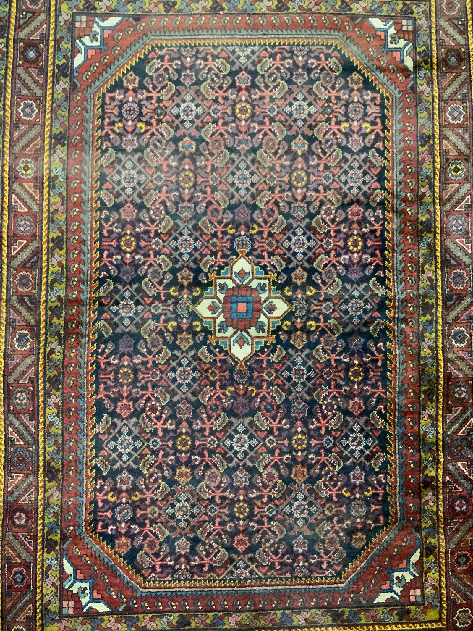 Vintage Handmade Persian Wool Area Rug: Rug is handmade and wool. Piece has intricate multi toned floral motif & geometric derail. Rug is vintage. Piece measures approximately 78 inches long 55 inches wide Rug, carpet, wool rug, Persian rug