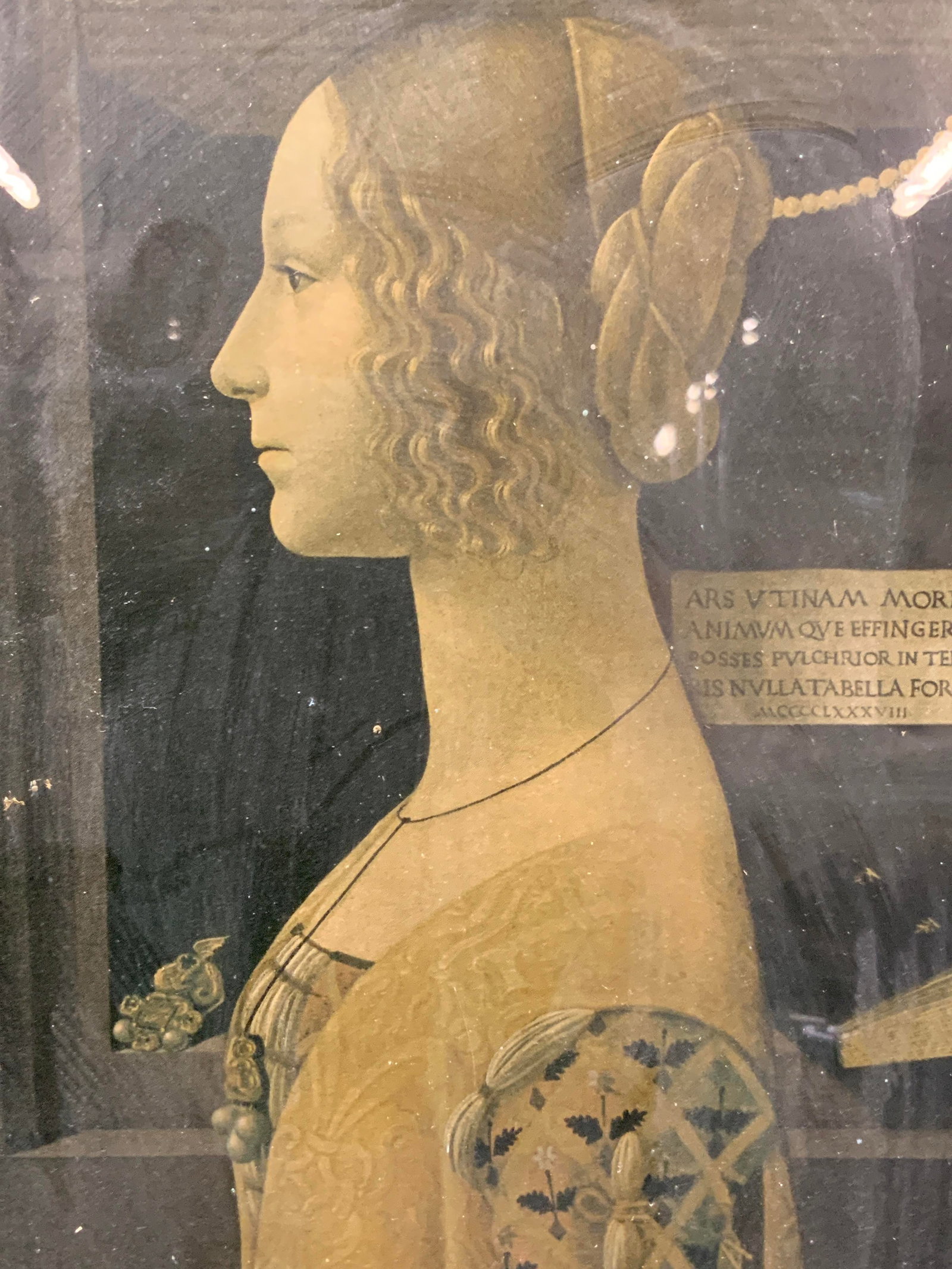 Portrait of Giovanna Tornabuoni Lithograph: Portrait of Giovanna Tornabuoni by Posterazzi lithograph depicting the young woman in profile with a black Bible in the background and her jewelry in the window sill behind her. Framed in a dark woode