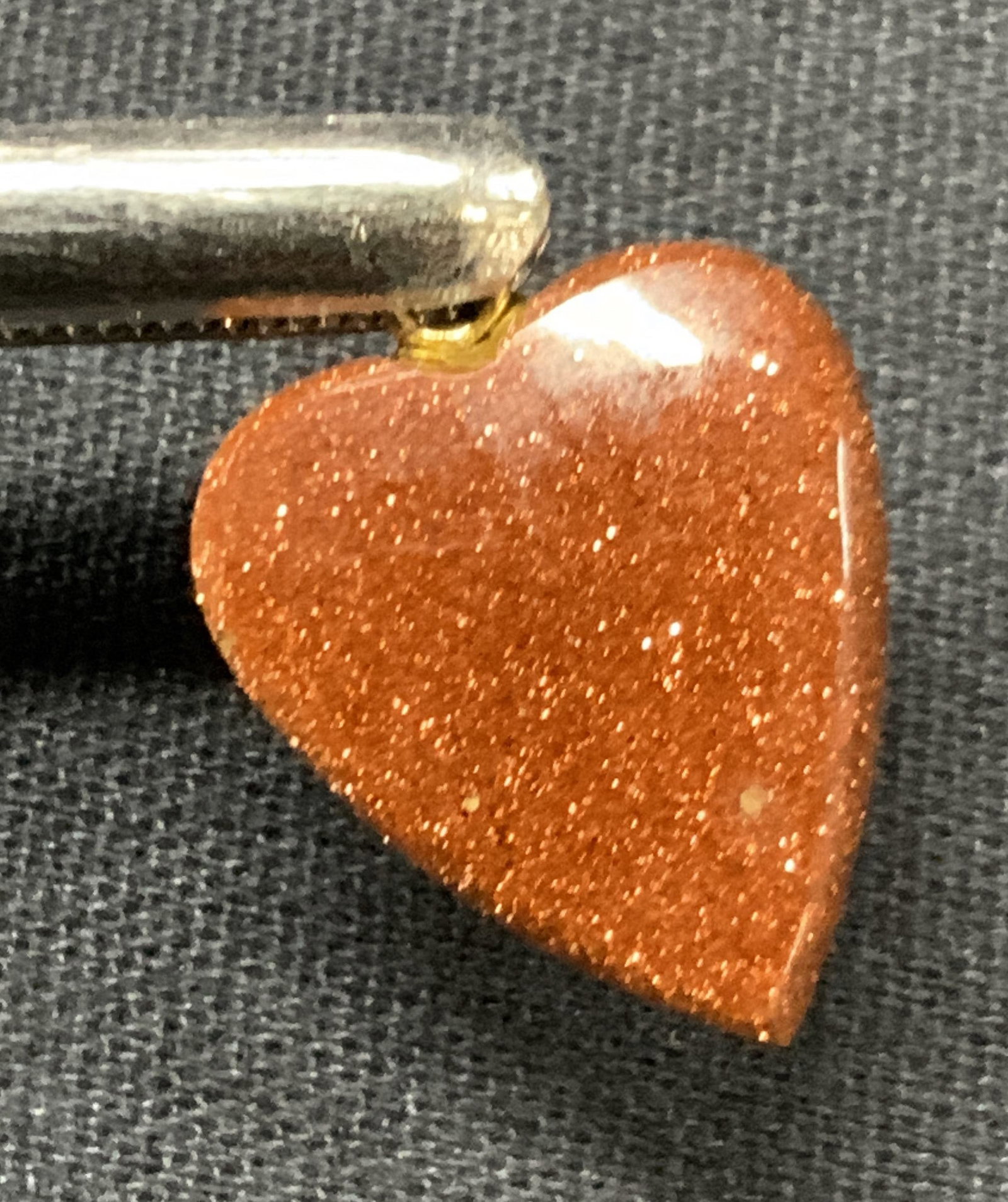 Gold Stone Heart Pendant: Heart shape pendant made of gold stone. Approx 0.75 inches long. Minor wearing to pendant due to age and use Gold stone pendant, gold stone decor, jewelry, jewelry making, Necklace pendant. Pendant. F