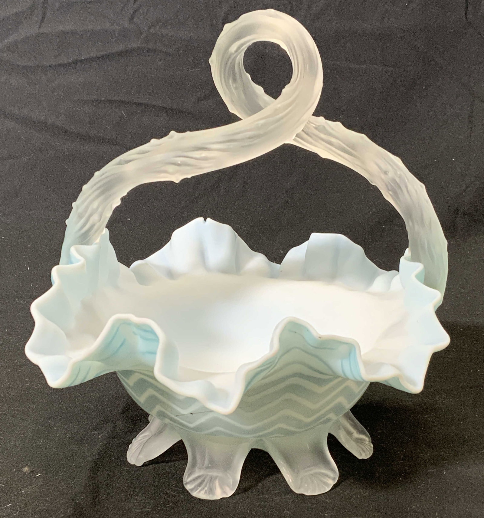 Vintage Hand Blown Light Blue Glass Bridal Basket: Vintage hand blown light blue glass bridal basket. Small chip to basket and chip to base, surface wear consistent with age, use, and exposure. Measures approx. 7.75 inches wide and 8 inches tall. Prop