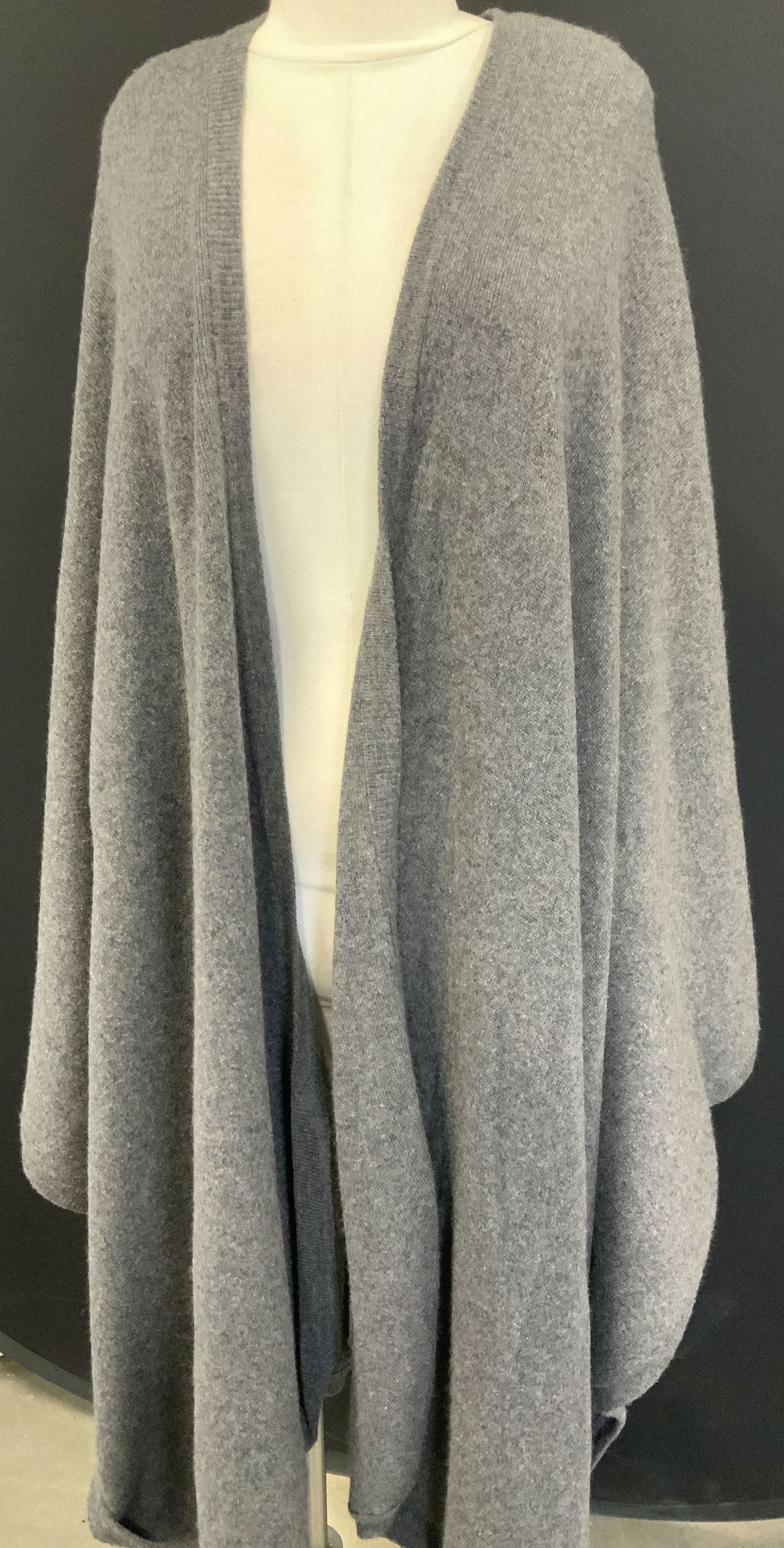 Oversized Cashmere Cape- Shawl, Hong Kong: Medium grey 100% cashmere serape/ shawl. One size fits all. Oversized wit long length wrap ends. Designer label cut out, fabric label reads 100% cashmere made in Hong Kong. Length in back 44 in. Long.