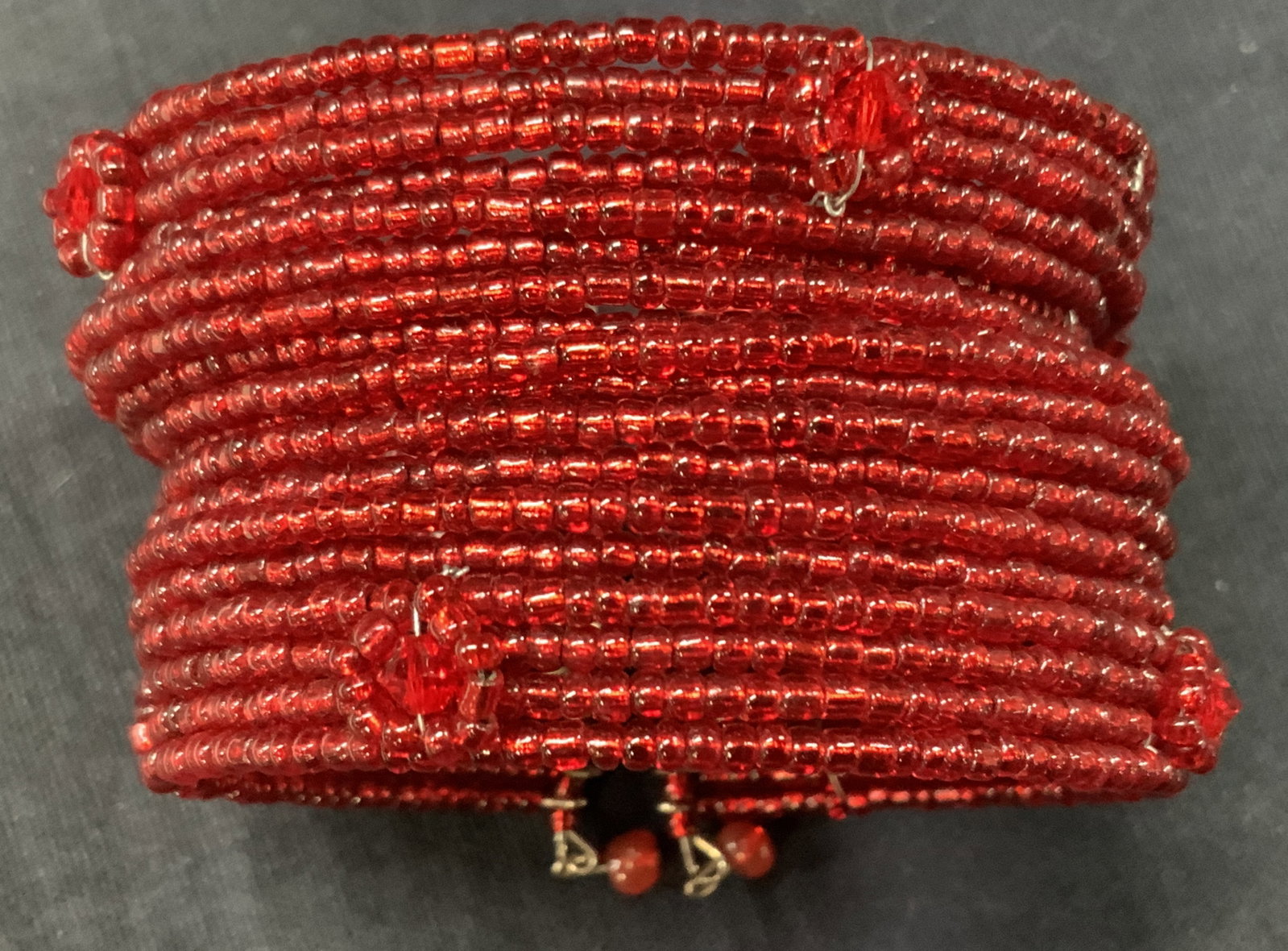Vntg Red Seed Bead Cuff Bracelet: Red toned seed bead crafted cuff bracelet with floral motifs, approx 2.18 inch diameter. Minor wearing to metal or beading to bracelet Seed bead jewelry, seed bead bracelet, cuff bracelet, bracelet, h