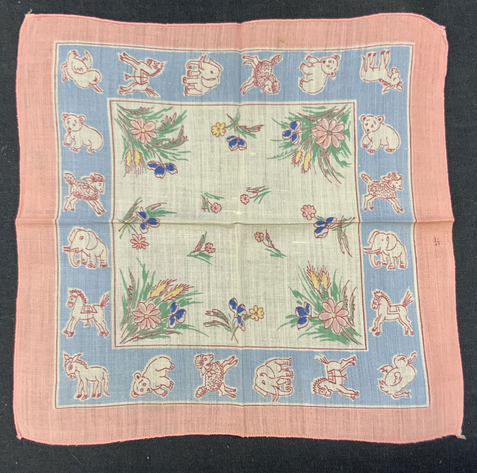 Vintage Animal Graphic Linen Handkerchief: Vintage linen handkerchief with vibrant color graphics of Animals in the boarder with pink and blue tones with colored grass and cat tail pants. Approx 7.75 x 7.75 inches Minor discoloration from age