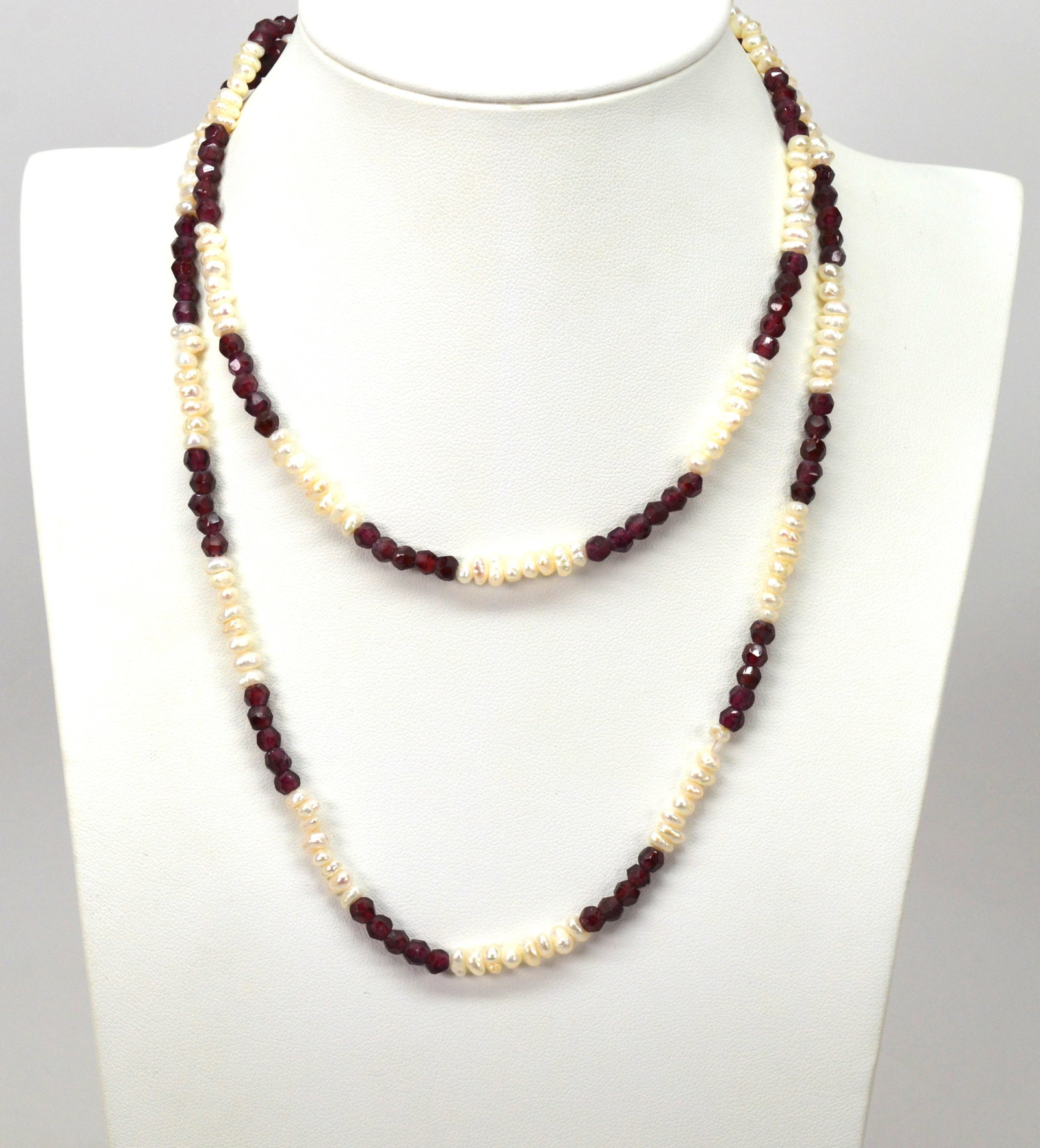 Natural Pearl and Garnet Necklace: 31in strand of natural pearls and garnets. Can also be wrapped on wrist and worn as a bracelet! NB BS26