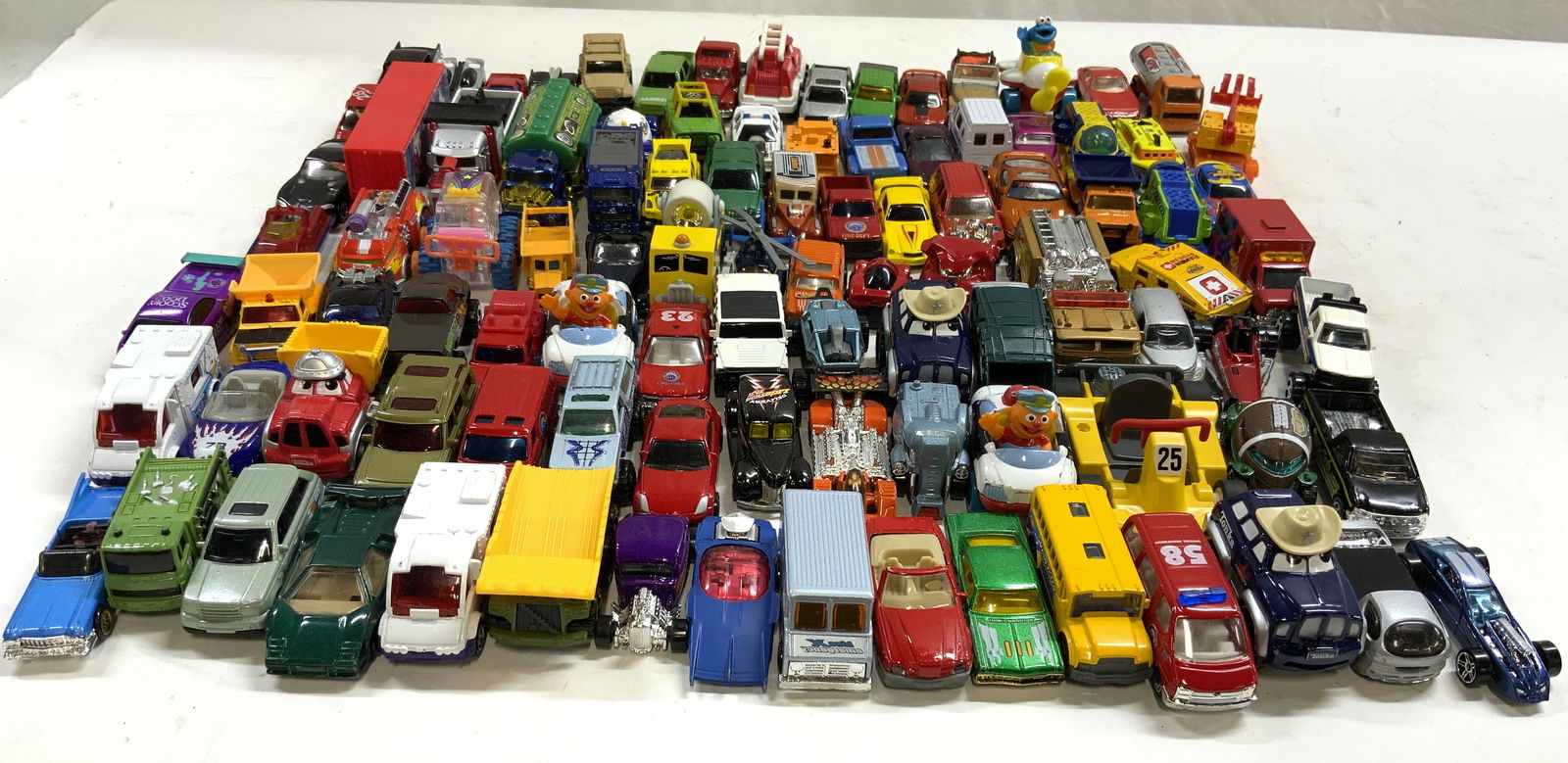 Lot 60+ Die Cast Toy Cars: Lot includes 60+ die cast toy cars. Includes brands such as hotwheels, matchbox & more. Largest piece measures approximately 4 inches deep 3 inches wide 2 inches tall. Die cast cars, toy cars, matchbo